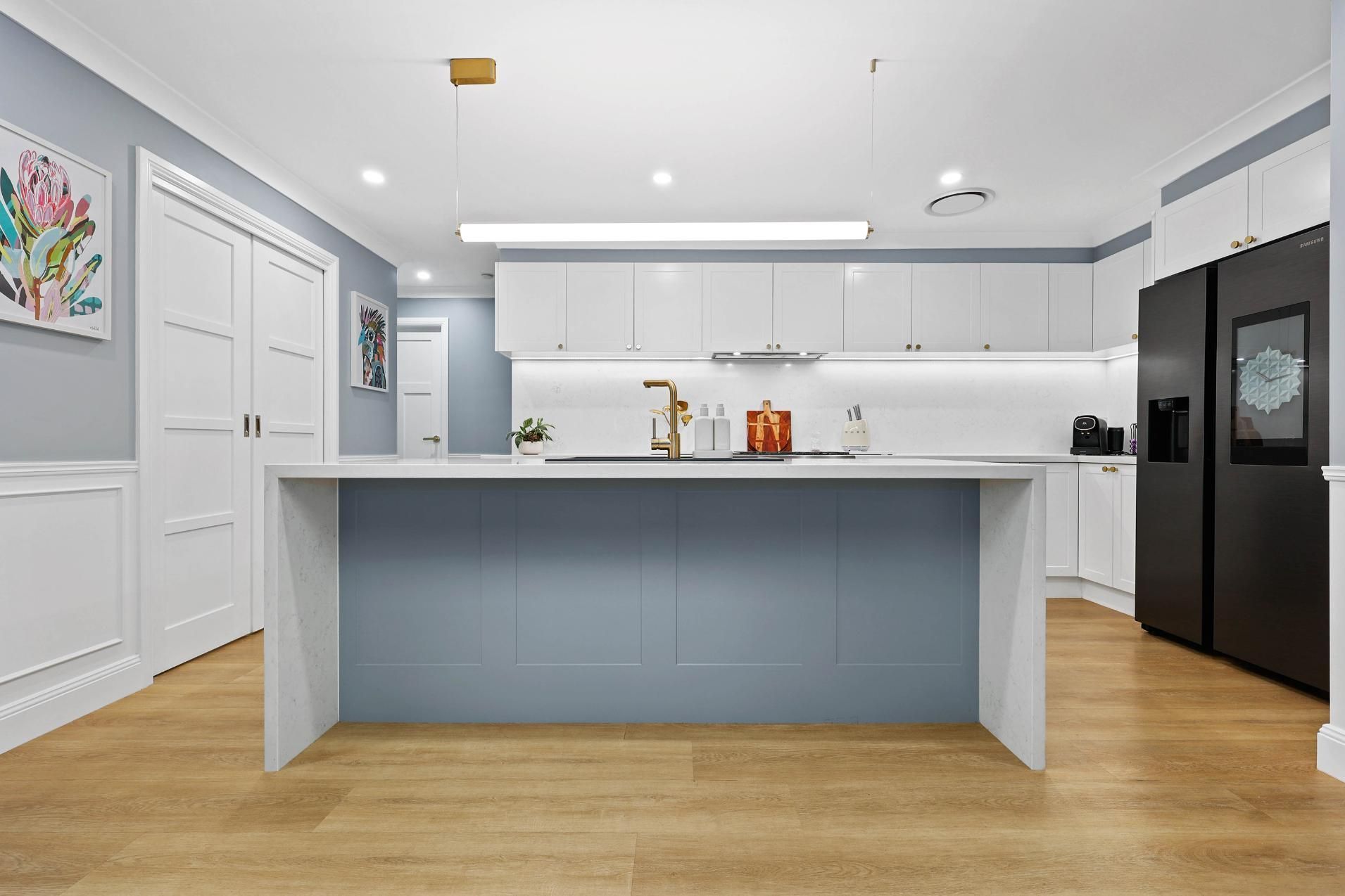 Bright Modern Kitchen With White Cabinets — Above & Beyond Interiors in Smeaton Grange, NSW