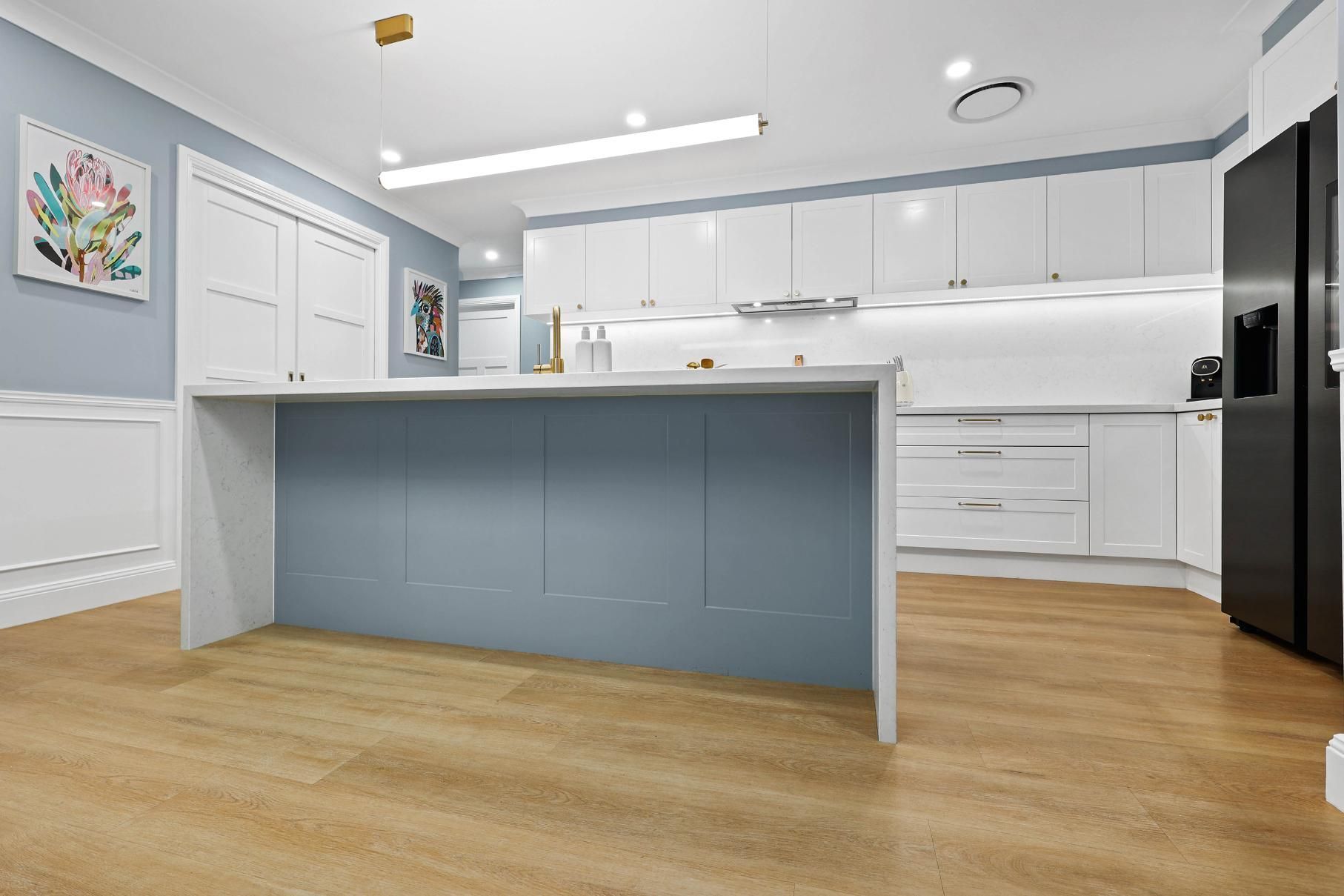 Bright Modern Kitchen With White Cabinets — Above & Beyond Interiors in Smeaton Grange, NSW