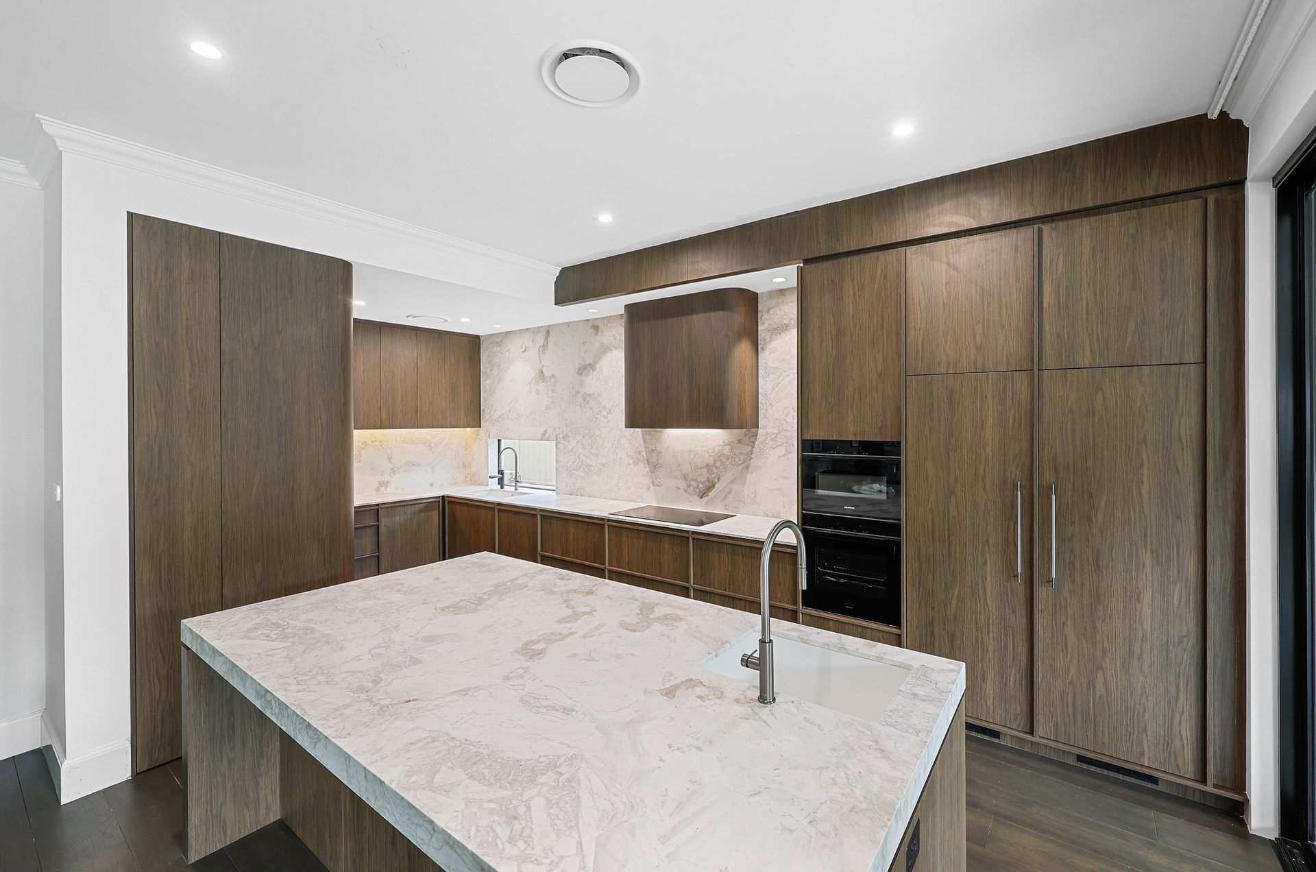 Modern Kitchen With Wood Cabinets, White Island Countertop — Above & Beyond Interiors in Smeaton Grange, NSW