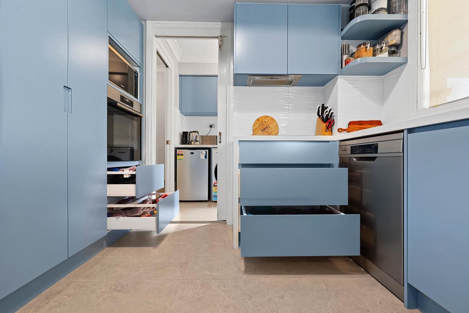 Blue Kitchen With Open Drawers, White Countertop — Above & Beyond Interiors in Smeaton Grange, NSW
