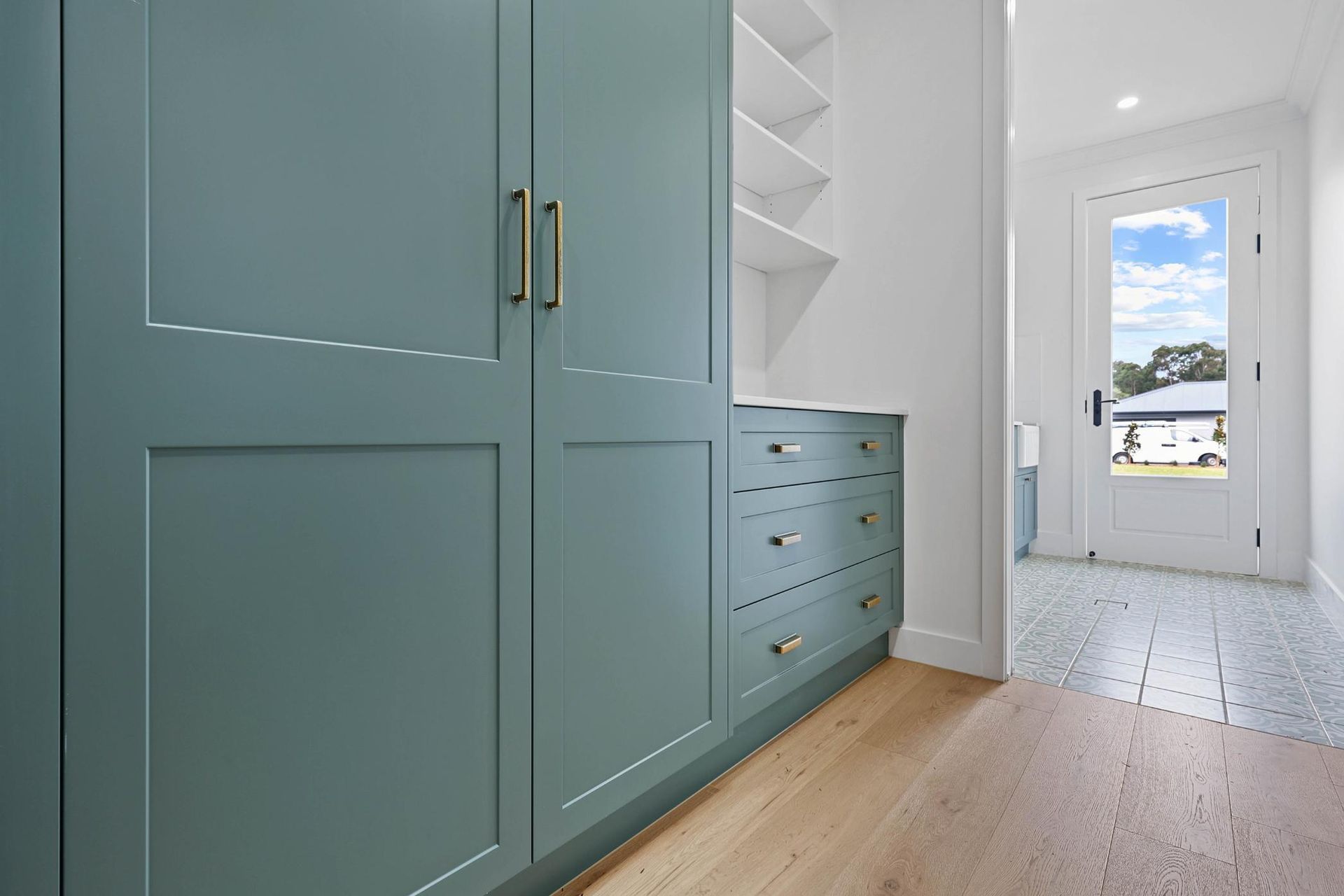 Mint-green Built-in Cabinets in a Bright Hallway — Above & Beyond Interiors in Smeaton Grange, NSW