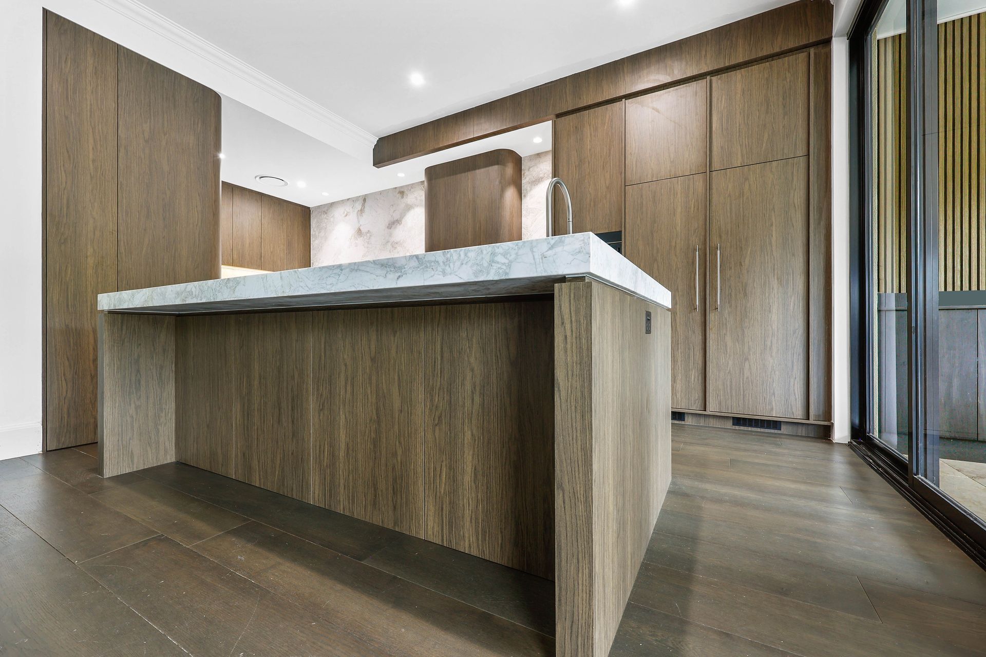Modern Kitchen With a Large Wood Island — Above & Beyond Interiors in Smeaton Grange, NSW