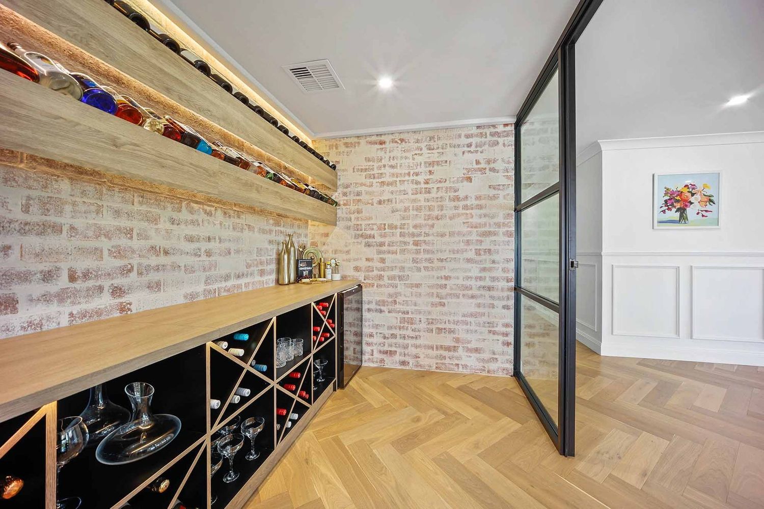 Modern Room With a Wine Rack, Herringbone Wood Floor — Above & Beyond Interiors in Smeaton Grange, NSW