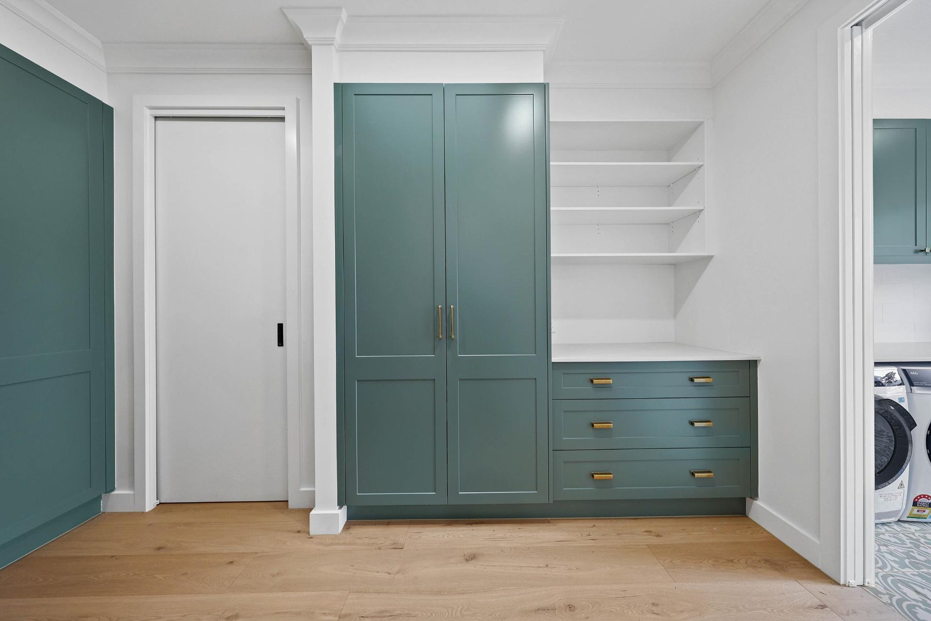 Built-in Teal Cabinetry and Shelves — Above & Beyond Interiors in Smeaton Grange, NSW