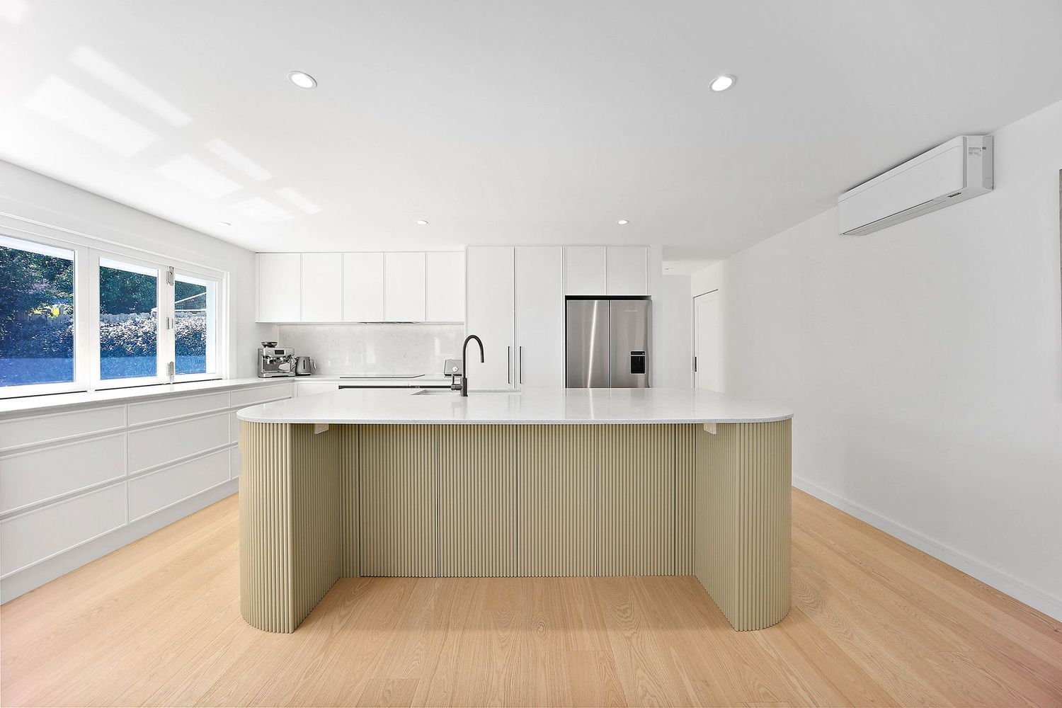 Bright Modern Kitchen With White Cabinets — Above & Beyond Interiors in Smeaton Grange, NSW