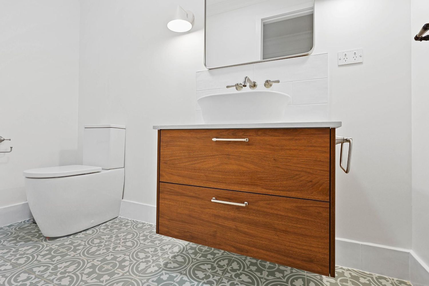 Modern Bathroom With White Toilet, Patterned Tile Floor — Above & Beyond Interiors in Smeaton Grange, NSW