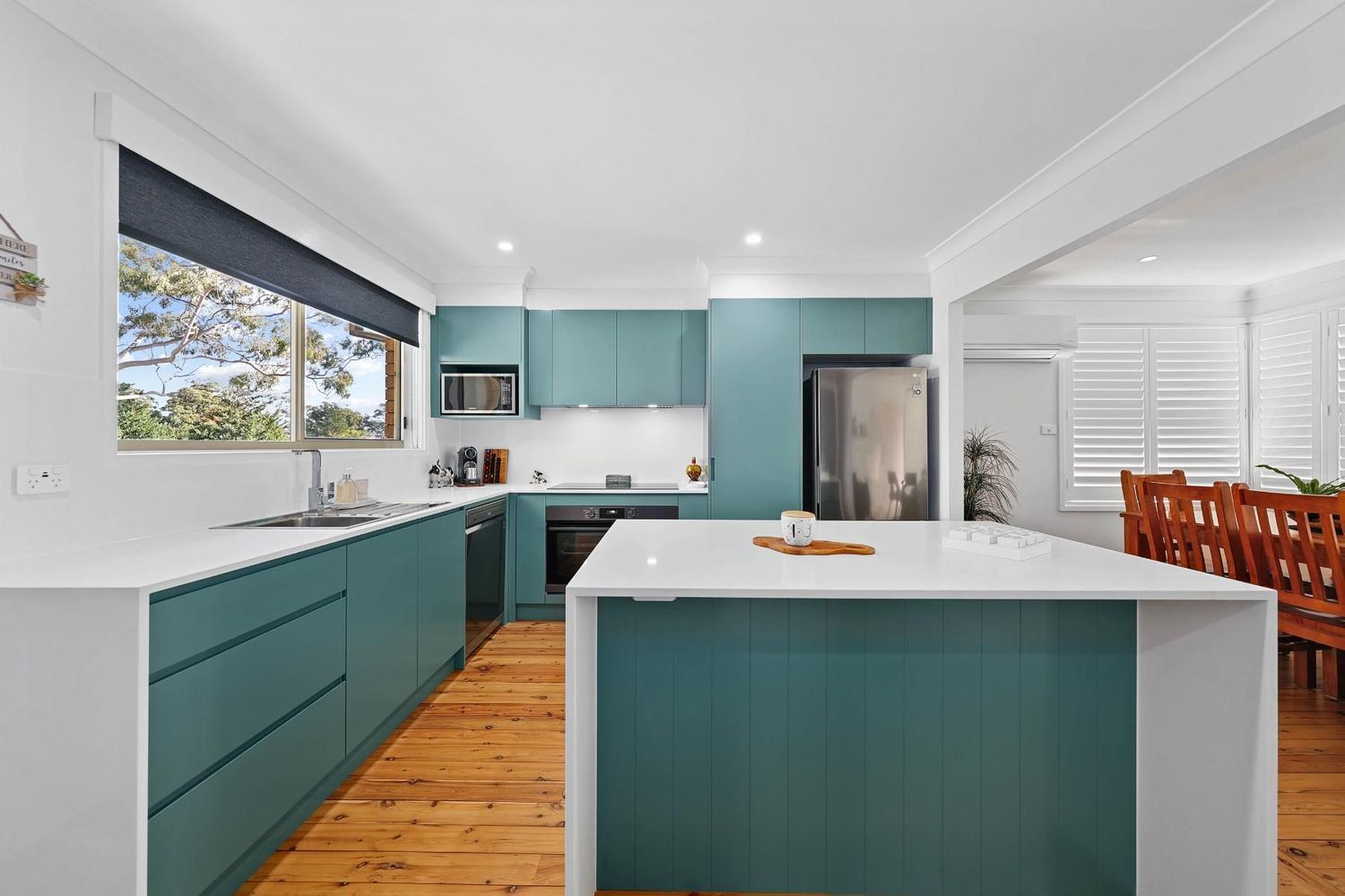 Modern Kitchen With Teal Cabinets, White Island — Above & Beyond Interiors in Smeaton Grange, NSW