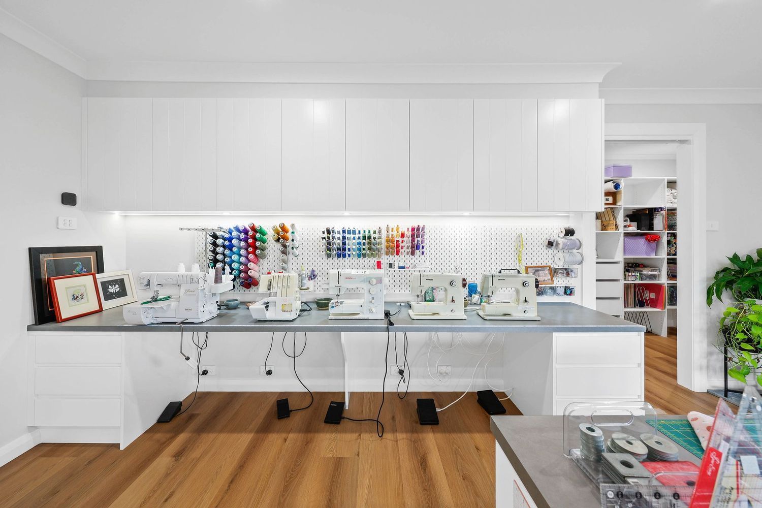 Bright Craft Room With Long White Sewing Table — Above & Beyond Interiors in Smeaton Grange, NSW