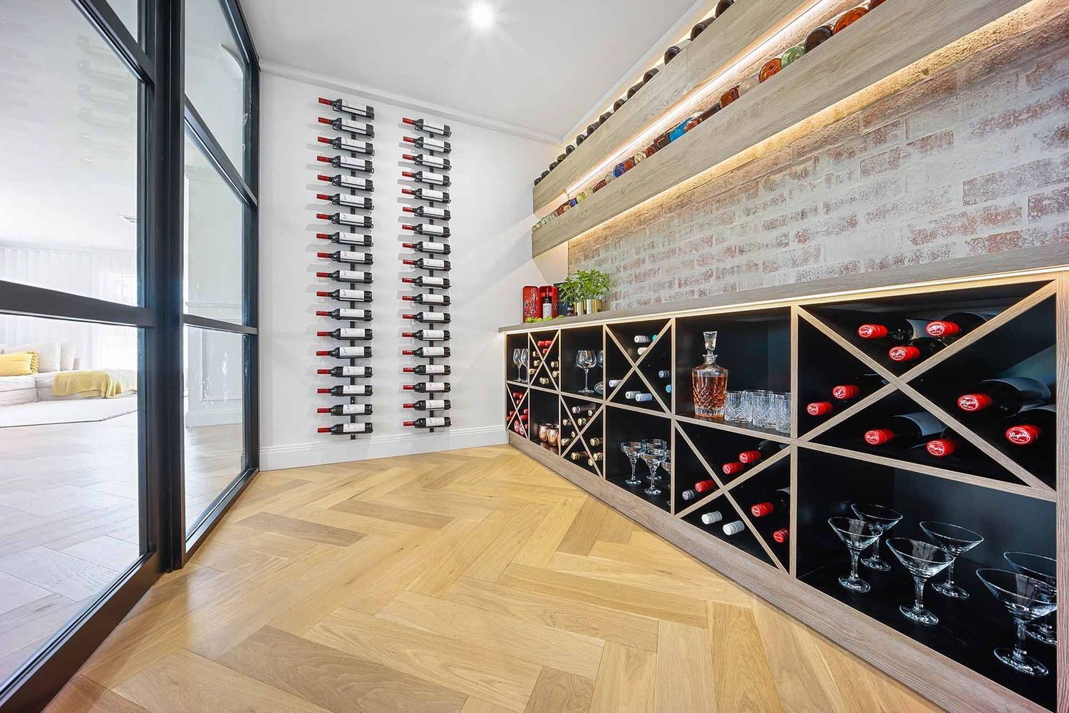 Modern Wine Cellar With Wall Racks, Glass Display Cabinets — Above & Beyond Interiors in Smeaton Grange, NSW