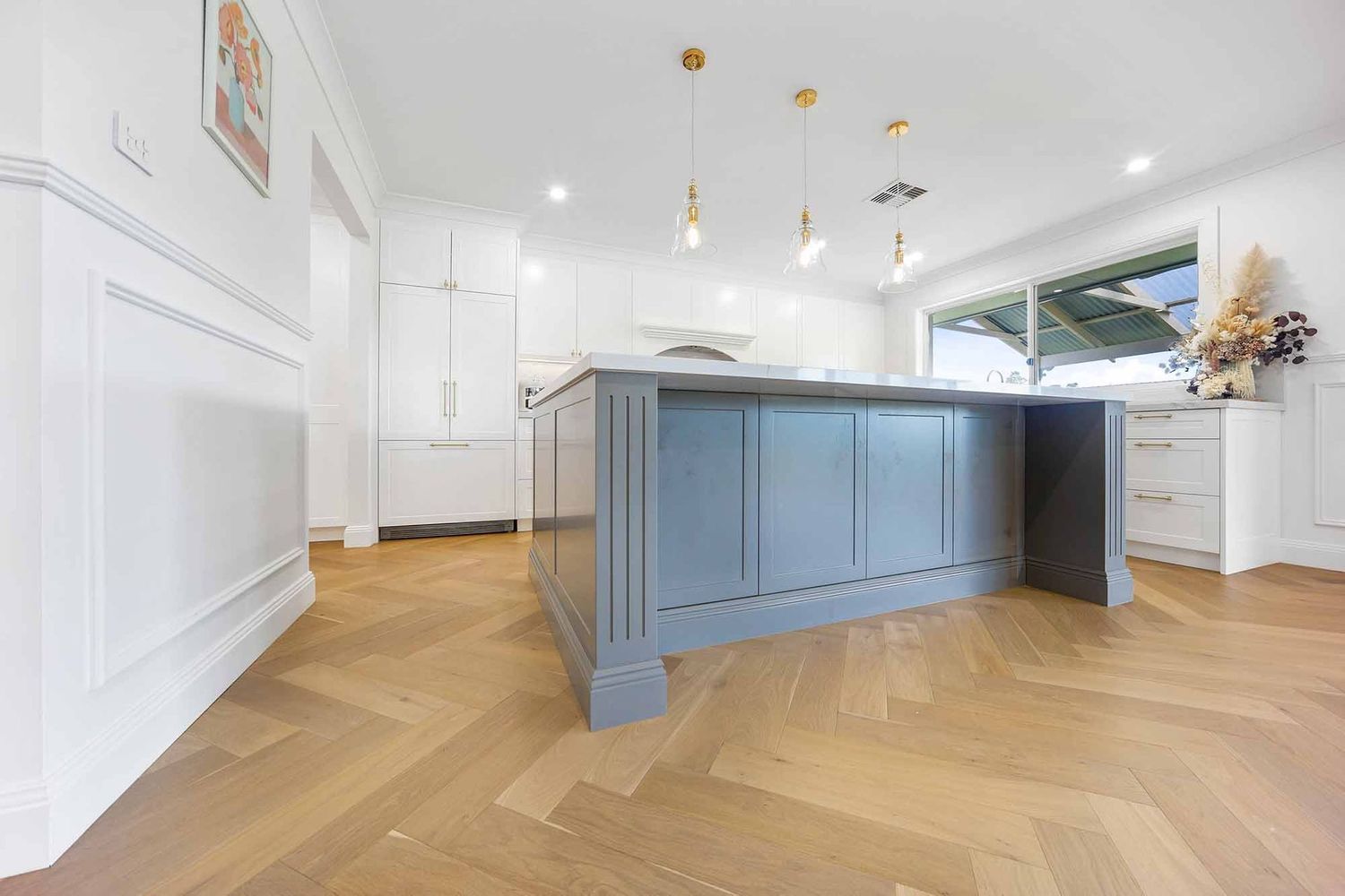 Bright Modern Kitchen With a Blue Island — Above & Beyond Interiors in Smeaton Grange, NSW