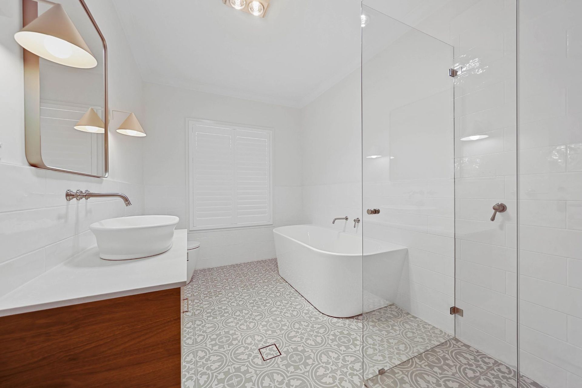 Bright Modern Bathroom With White Tub, Glass Shower — Above & Beyond Interiors in Smeaton Grange, NSW