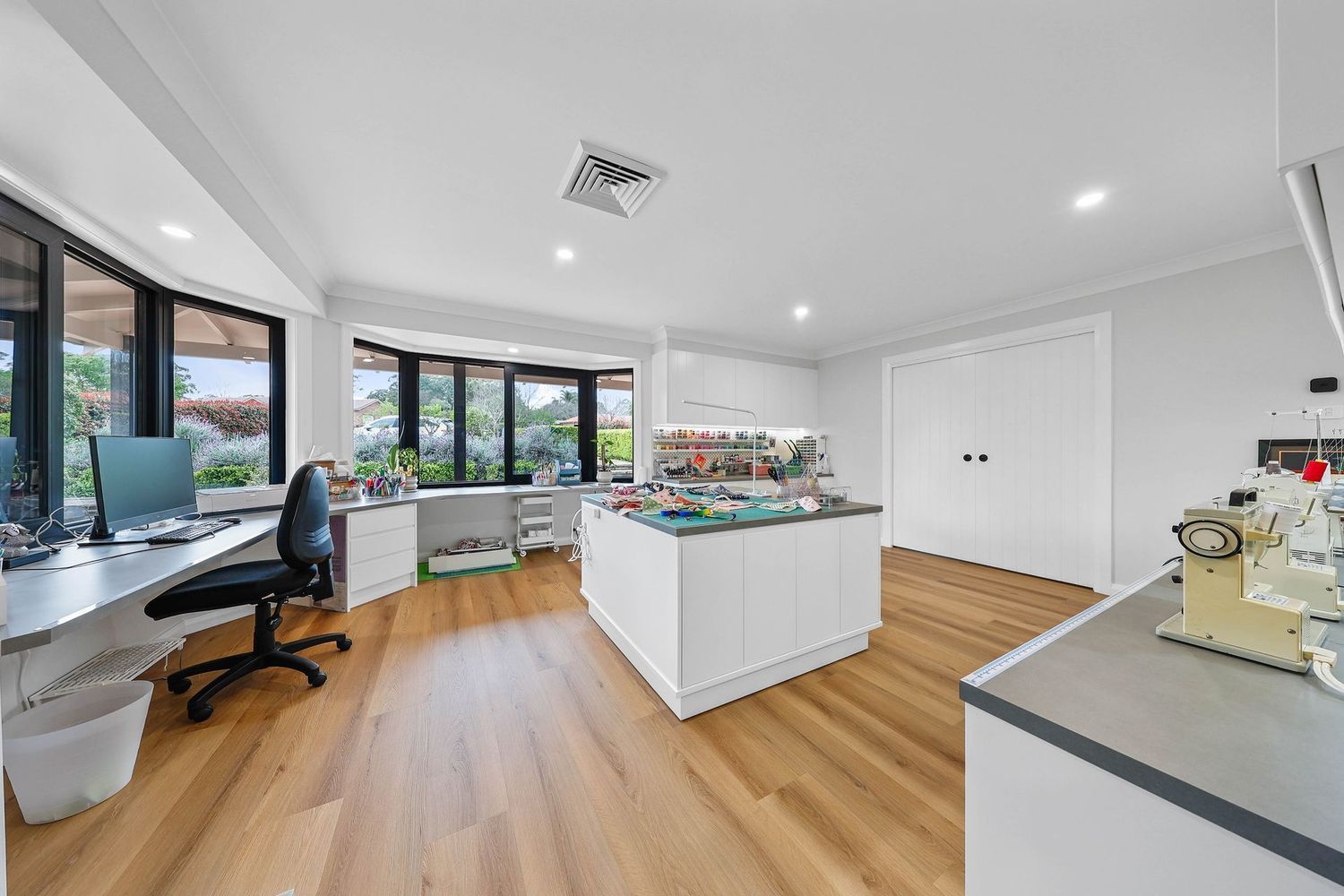 Modern Kitchen With Island, Wood Floors — Above & Beyond Interiors in Smeaton Grange, NSW