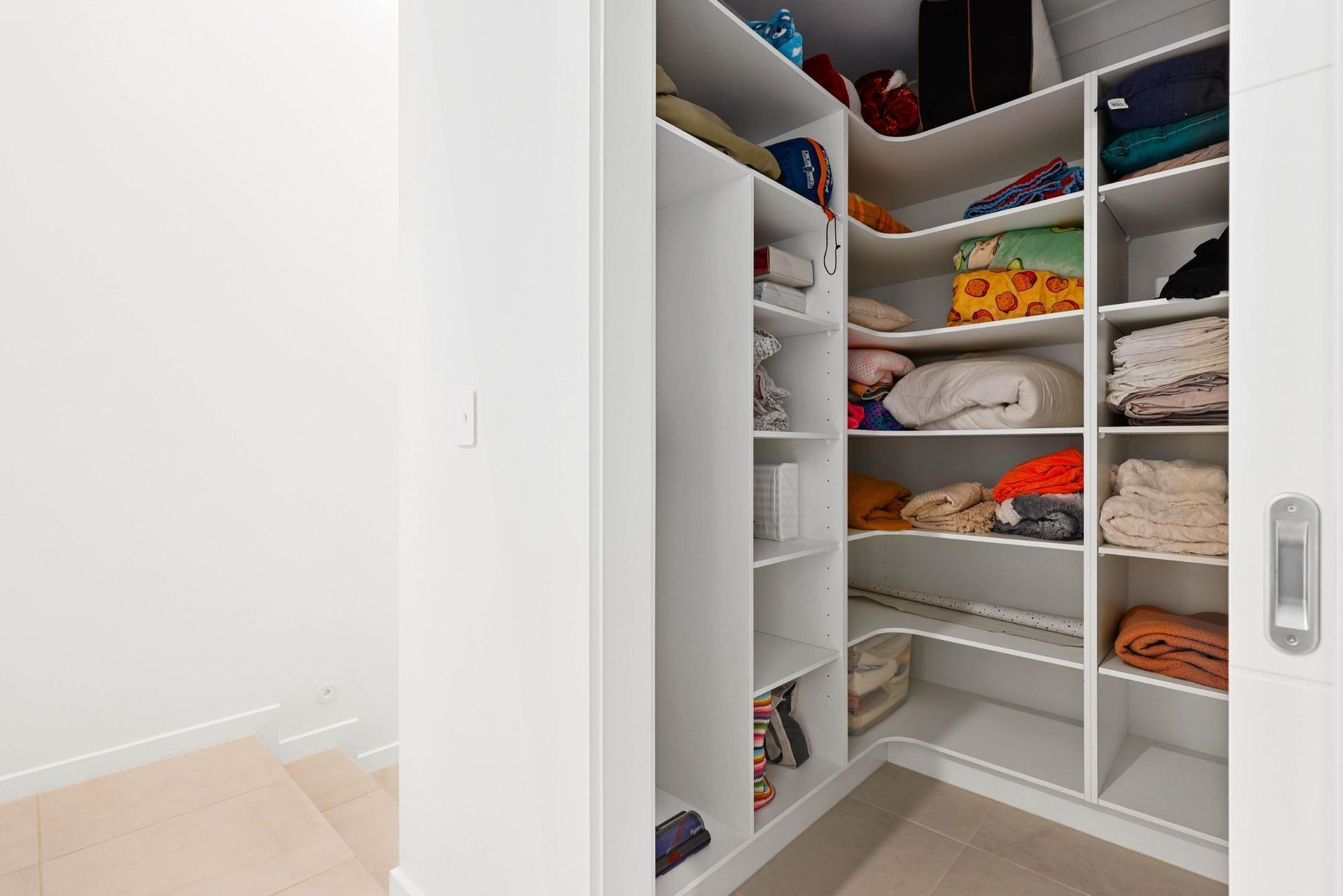Open Pantry Closet With White Shelves Stocked — Above & Beyond Interiors in Smeaton Grange, NSW