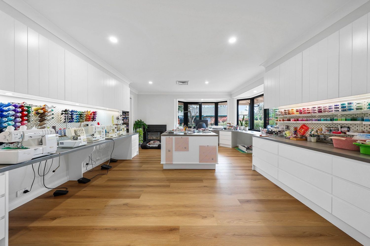 Bright White Retail Store Interior With Shelves — Above & Beyond Interiors in Smeaton Grange, NSW