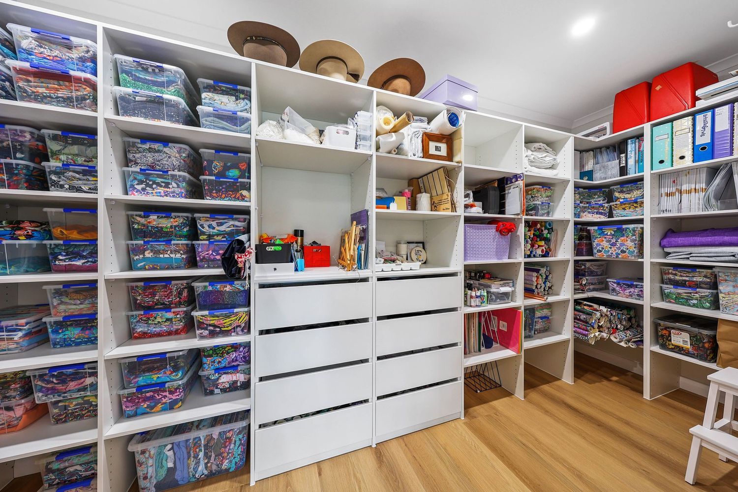 Organized Craft Room With White Shelves — Above & Beyond Interiors in Smeaton Grange, NSW