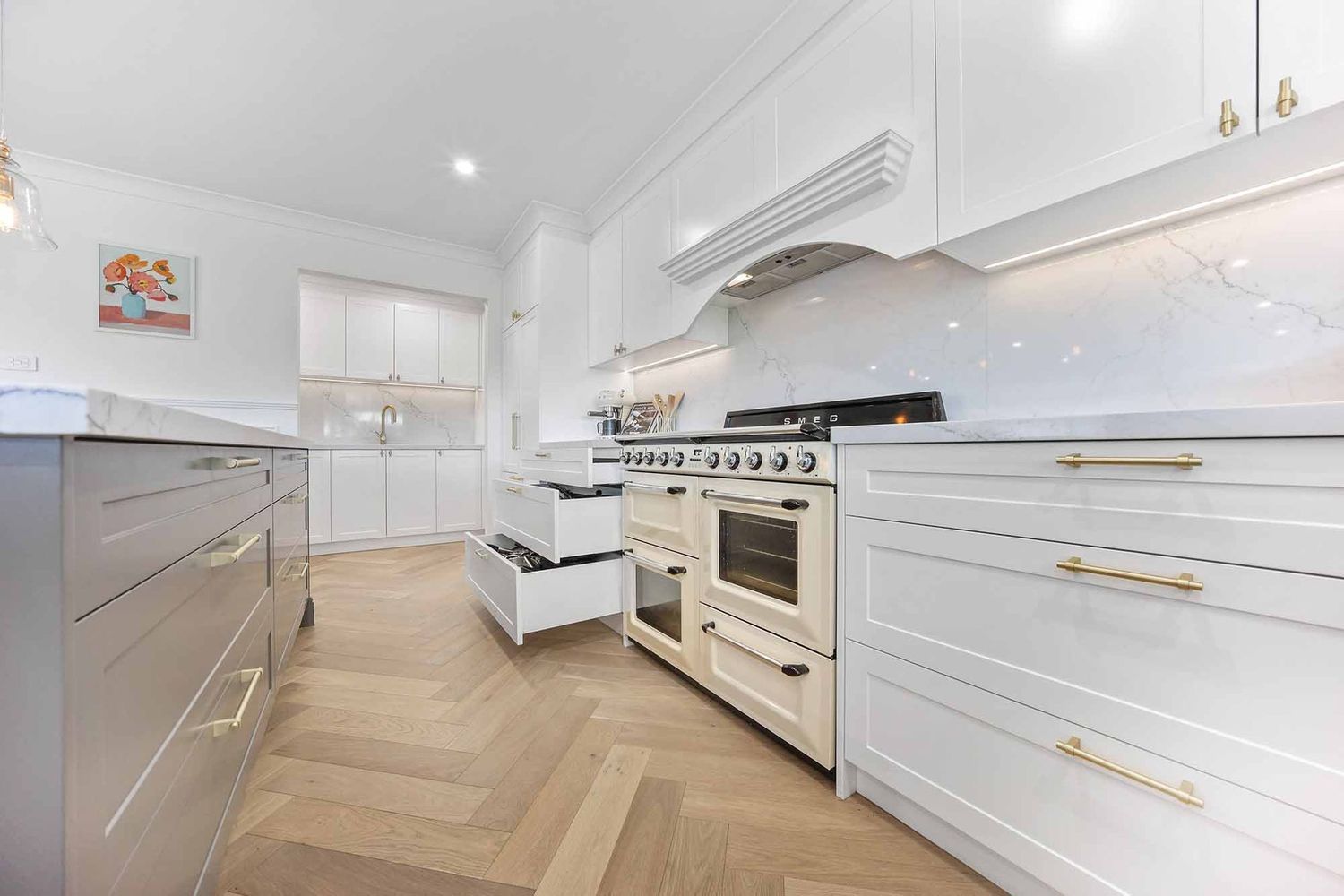 Bright White Modern Kitchen With Herringbone Wood Floor — Above & Beyond Interiors in Smeaton Grange, NSW