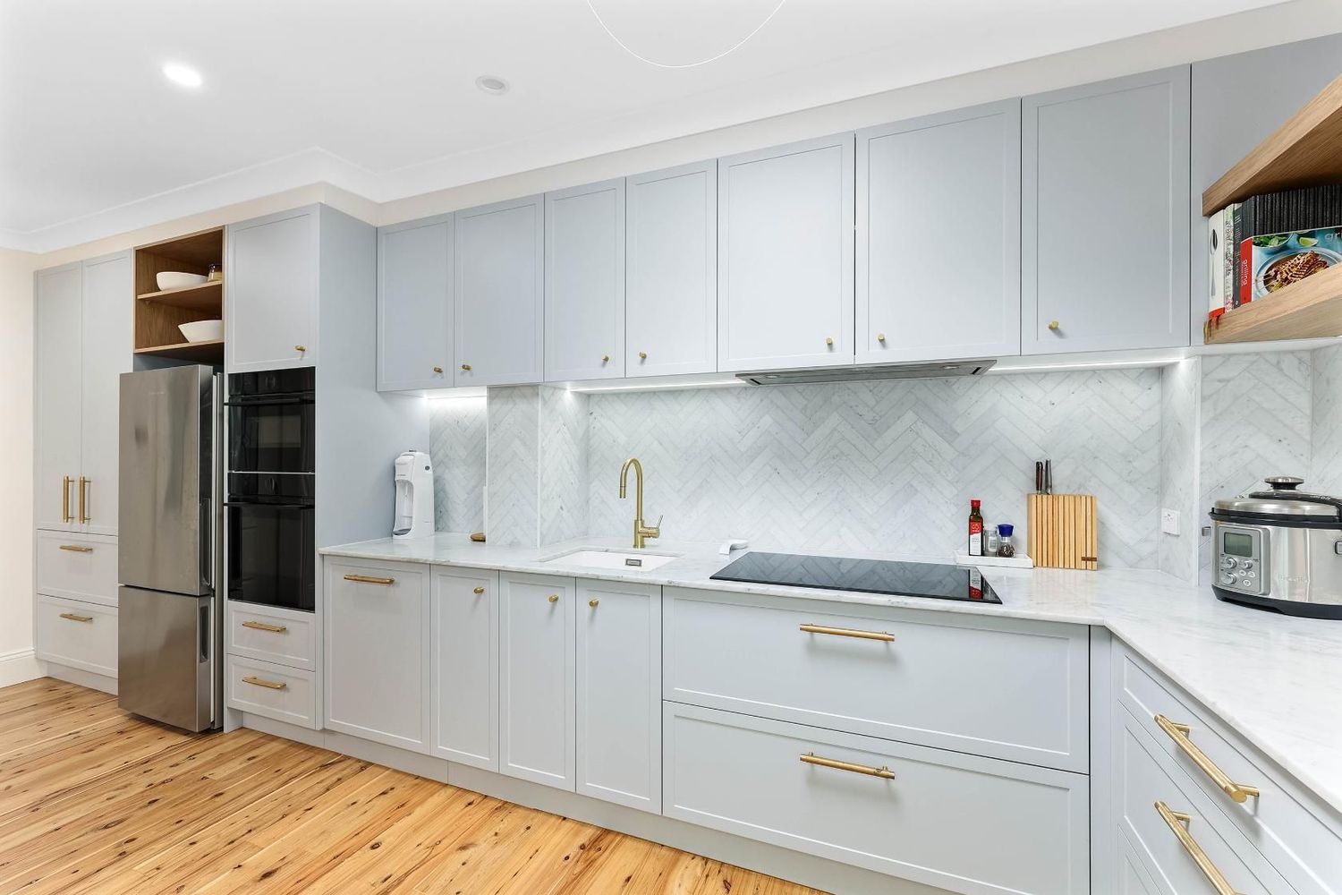 Bright Modern Kitchen With Light Blue Cabinets — Above & Beyond Interiors in Smeaton Grange, NSW