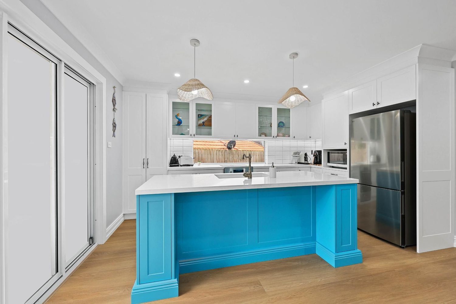 Bright Modern Kitchen With Turquoise Island — Above & Beyond Interiors in Smeaton Grange, NSW