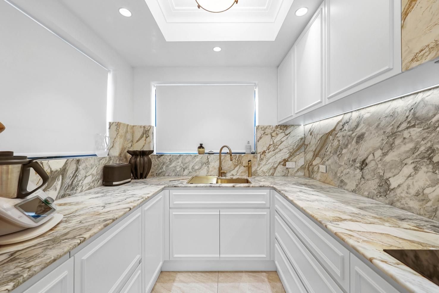 Bright White Kitchen With Marble Countertops, Tiled Backsplash — Above & Beyond Interiors in Smeaton Grange, NSW