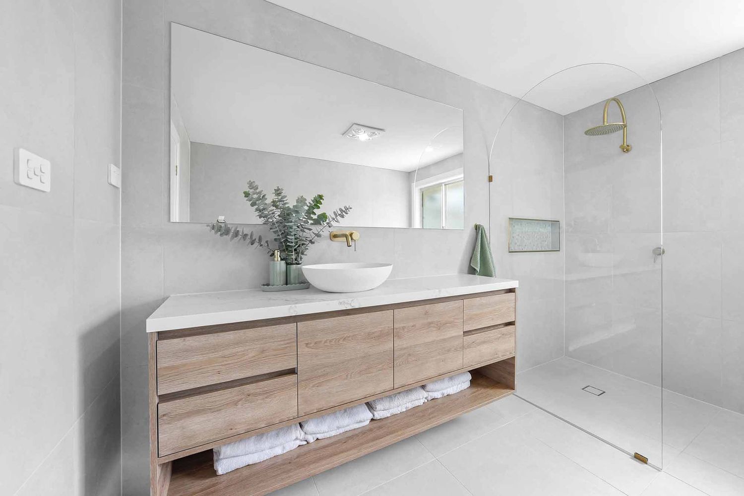 Modern Bathroom With a Wood Vanity, Large Mirror — Above & Beyond Interiors in Smeaton Grange, NSW