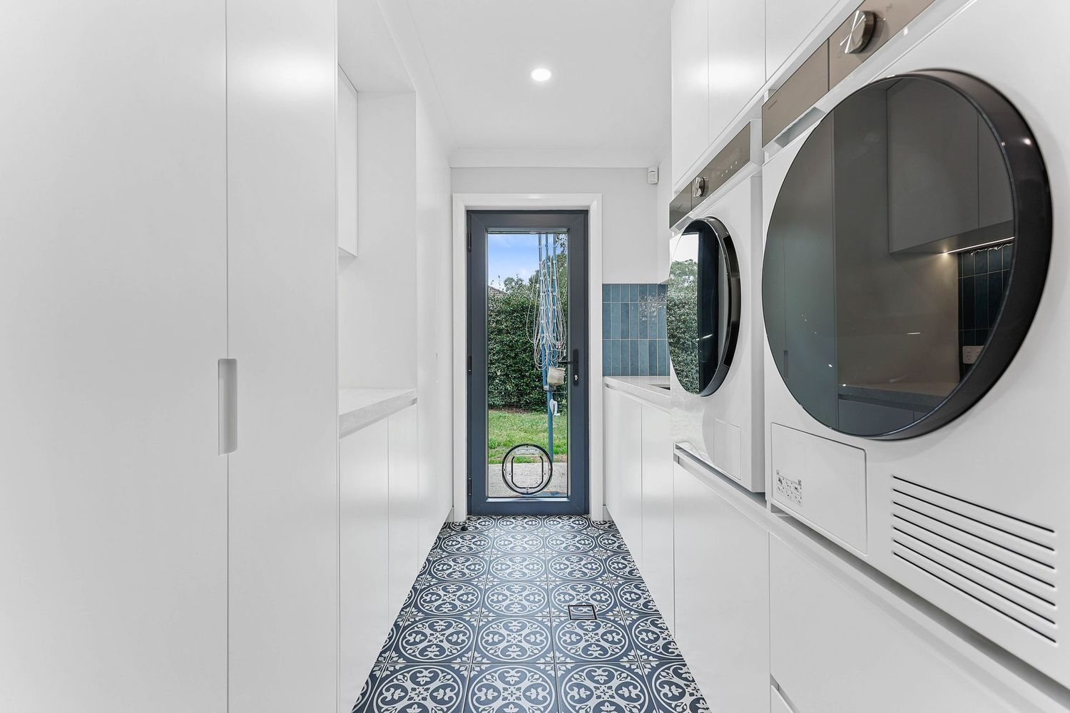 Bright Narrow Hallway With White Walls, Patterned Floor — Above & Beyond Interiors in Smeaton Grange, NSW