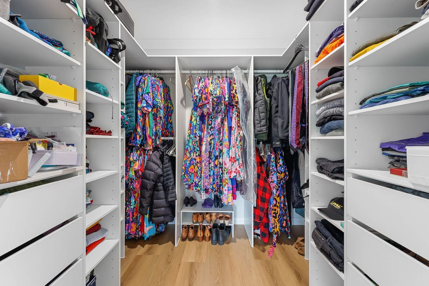 Walk-in Closet With Open Shelves, Hanging Colorful Clothes — Above & Beyond Interiors in Smeaton Grange, NSW