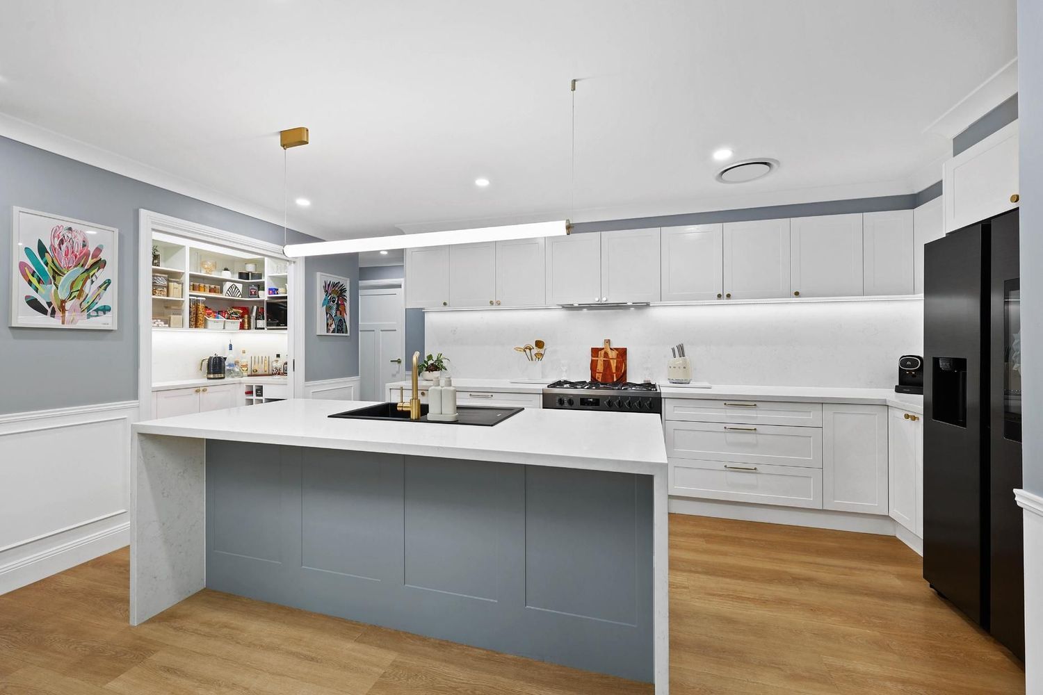 Modern White Kitchen With Blue Island — Above & Beyond Interiors in Smeaton Grange, NSW