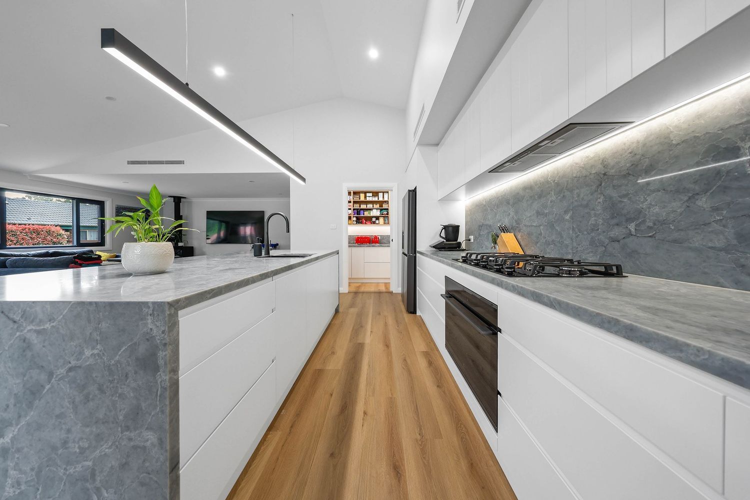 Bright Modern Kitchen With White Cabinets — Above & Beyond Interiors in Smeaton Grange, NSW