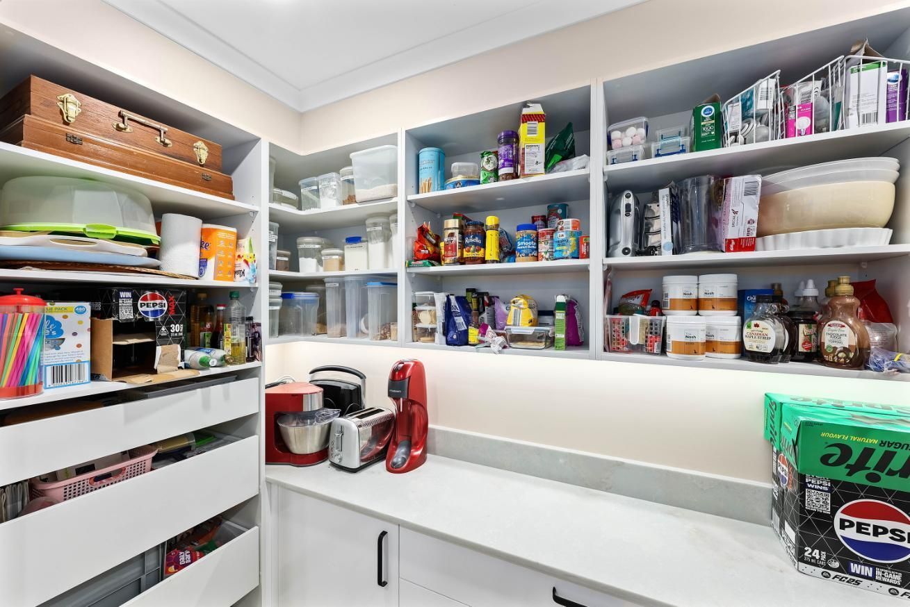 Organized Pantry With White Shelves, Jars — Above & Beyond Interiors in Smeaton Grange, NSW