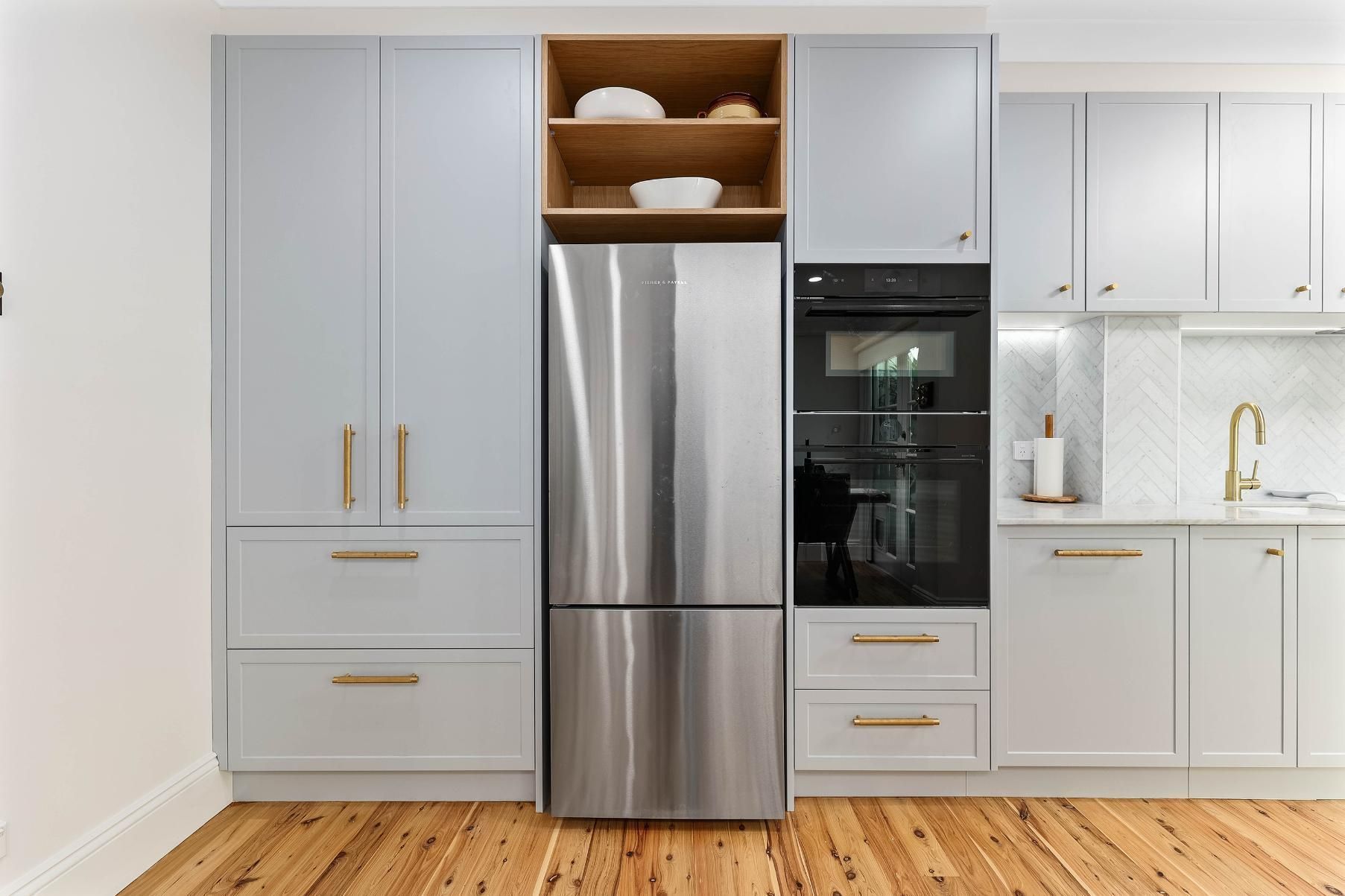Modern Kitchen With Light Gray Cabinets — Above & Beyond Interiors in Smeaton Grange, NSW