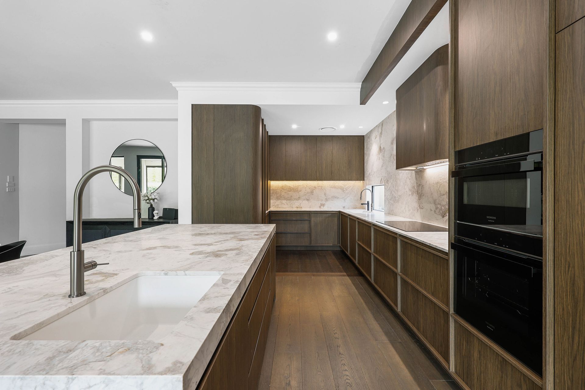 Modern Kitchen With Wood Cabinets, Marble Island — Above & Beyond Interiors in Smeaton Grange, NSW