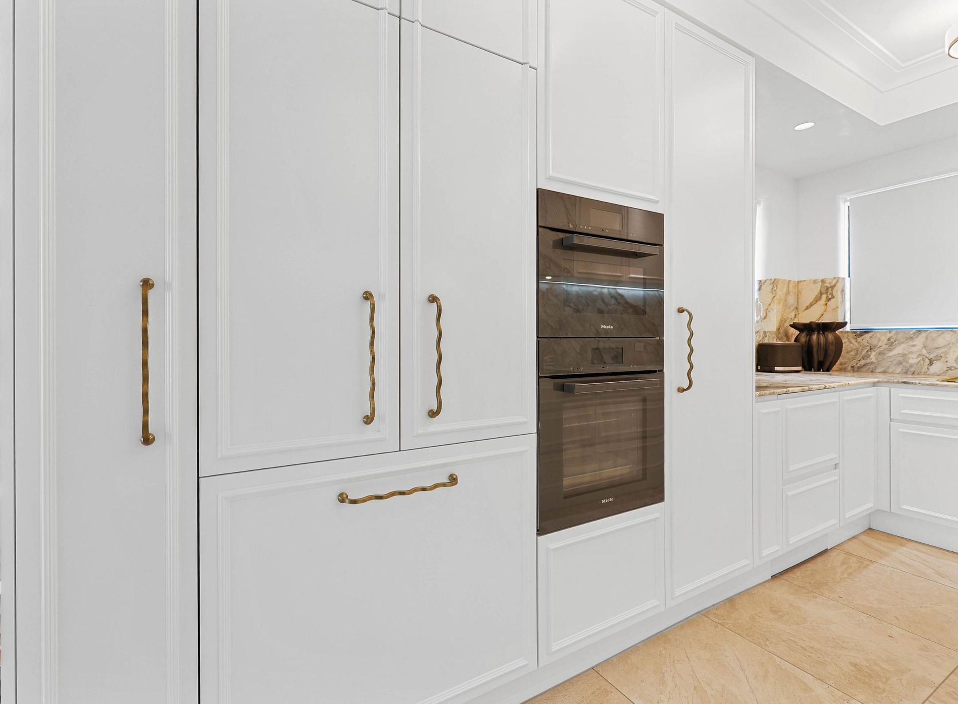 White Modern Kitchen With Built-in Oven — Above & Beyond Interiors in Smeaton Grange, NSW