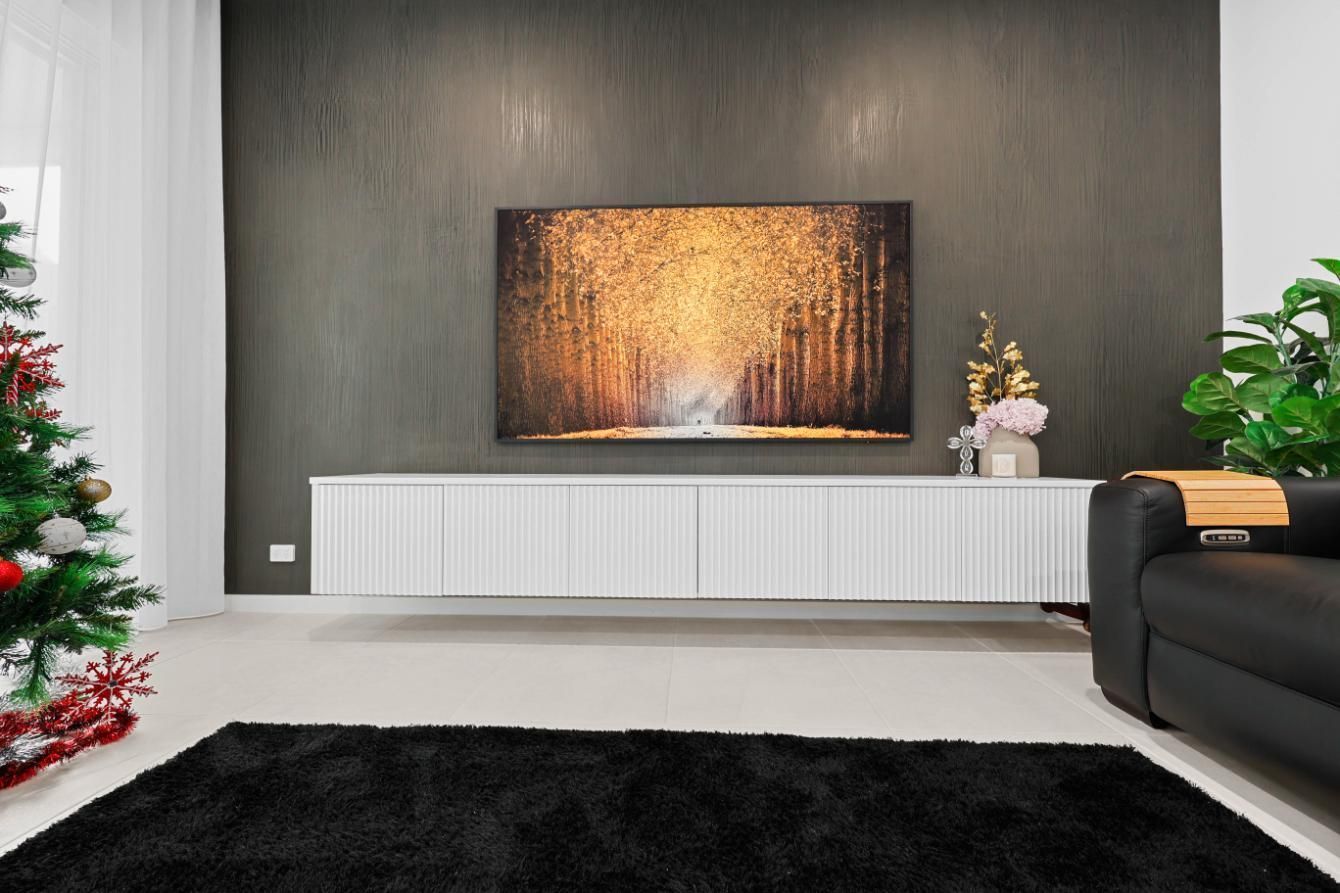 Modern Living Room With Wall-mounted Fireplace — Above & Beyond Interiors in Smeaton Grange, NSW