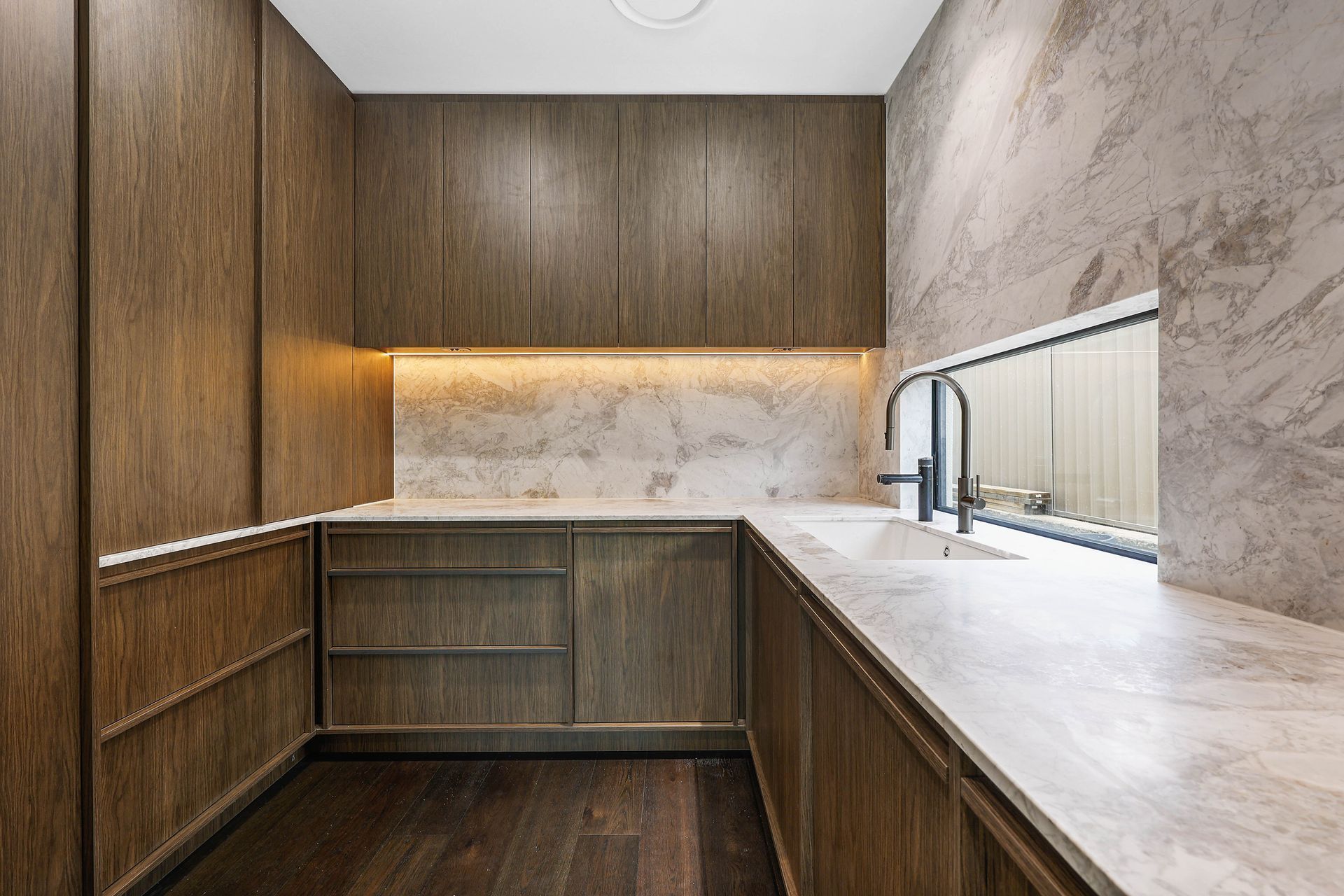 Modern Minimalist Kitchen Nook With Wood Cabinets — Above & Beyond Interiors in Smeaton Grange, NSW