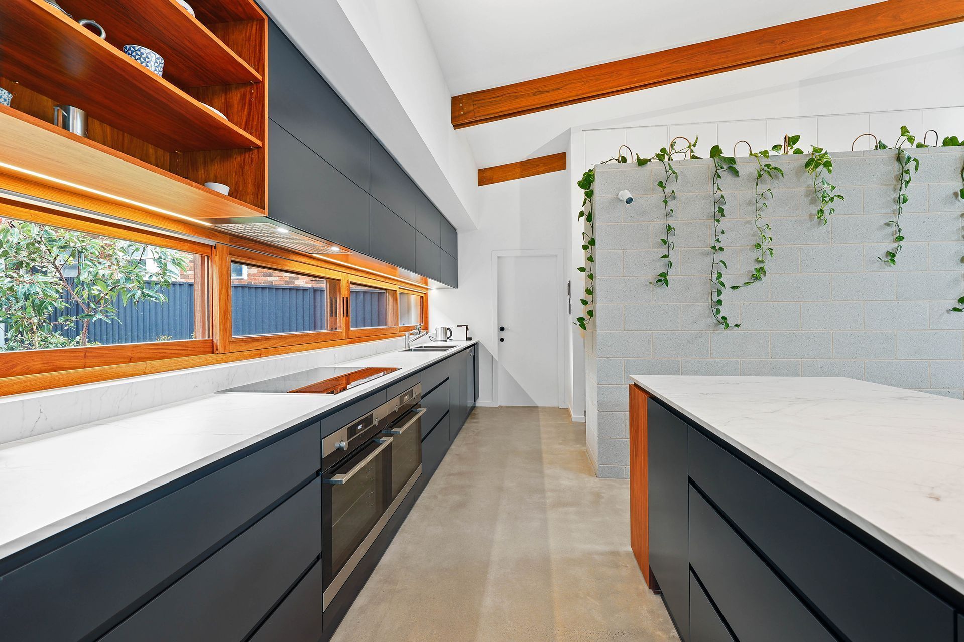 Modern Kitchen With White Countertops — Above & Beyond Interiors in Smeaton Grange, NSW