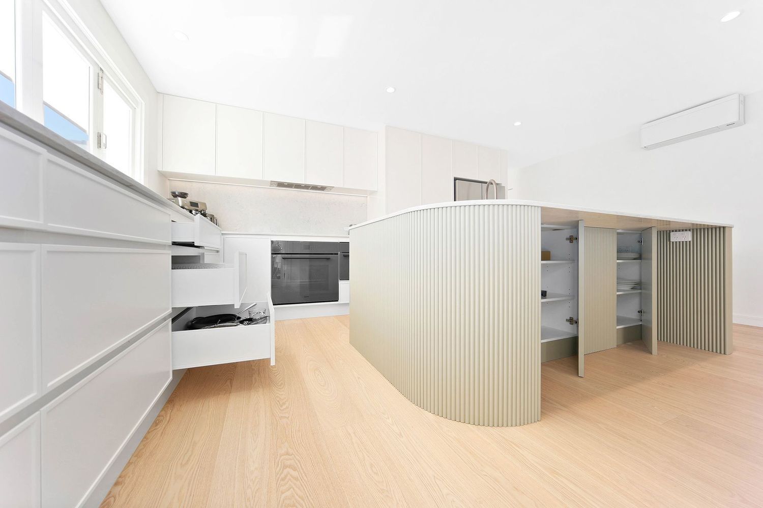 Bright Minimalist Interior With Curved White Walls — Above & Beyond Interiors in Smeaton Grange, NSW