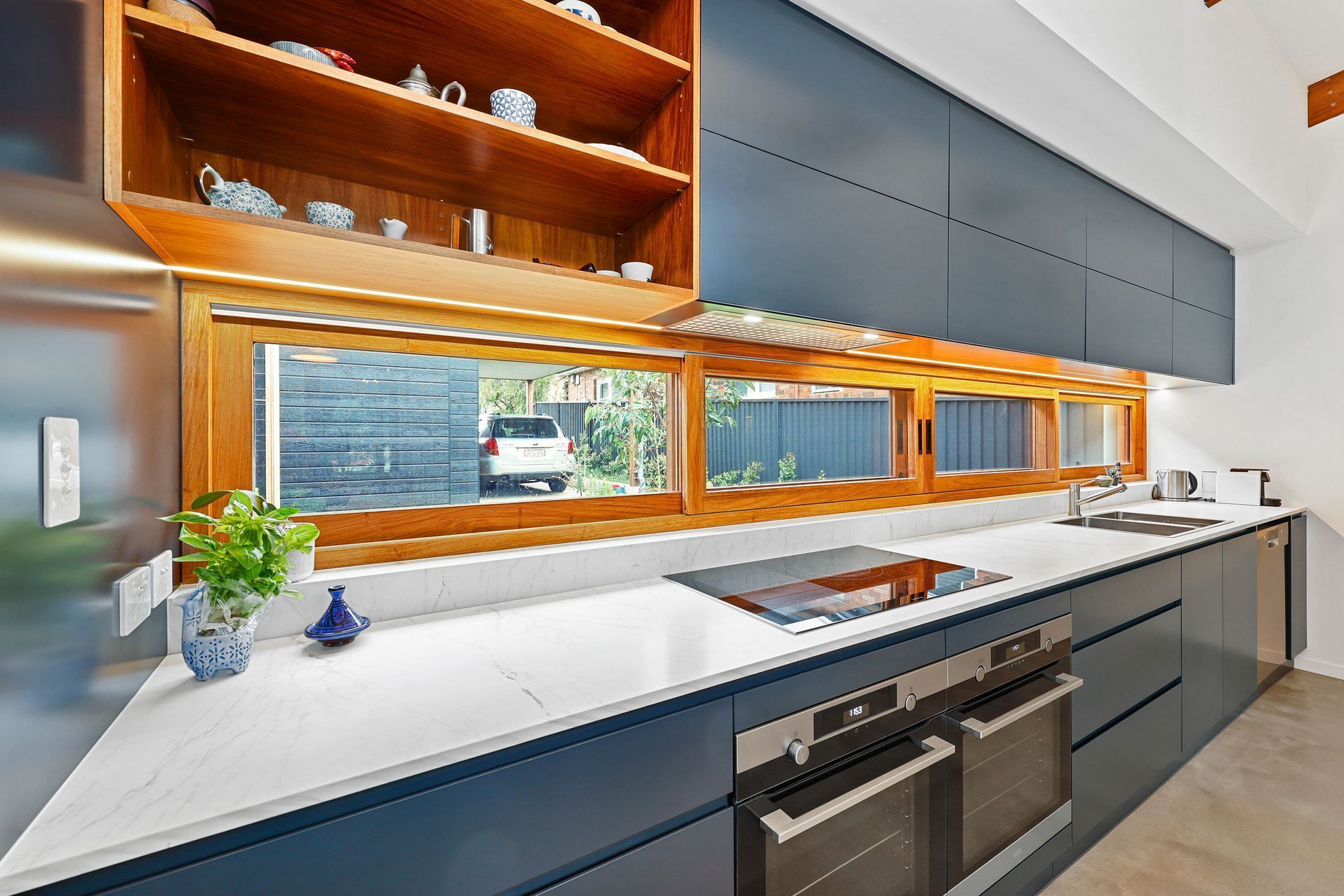 Modern Kitchen With White Countertops — Above & Beyond Interiors in Smeaton Grange, NSW
