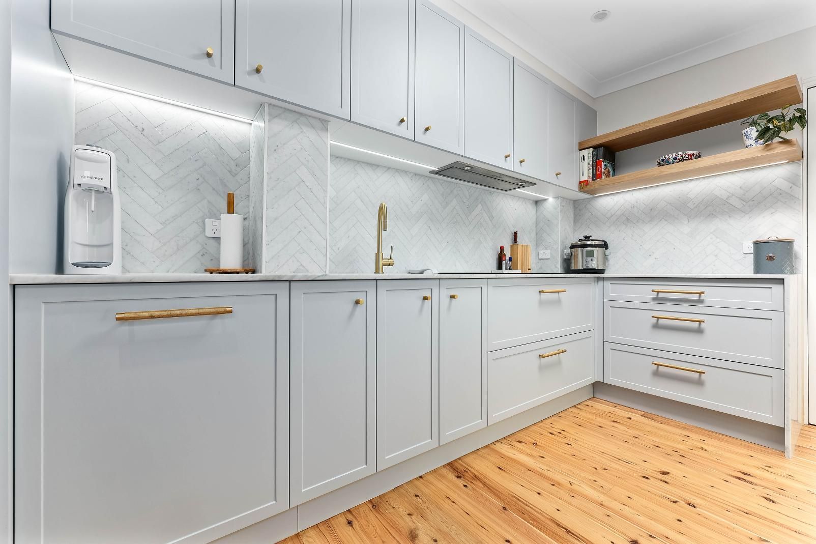 Bright Modern Kitchen With Light Gray Cabinets — Above & Beyond Interiors in Smeaton Grange, NSW