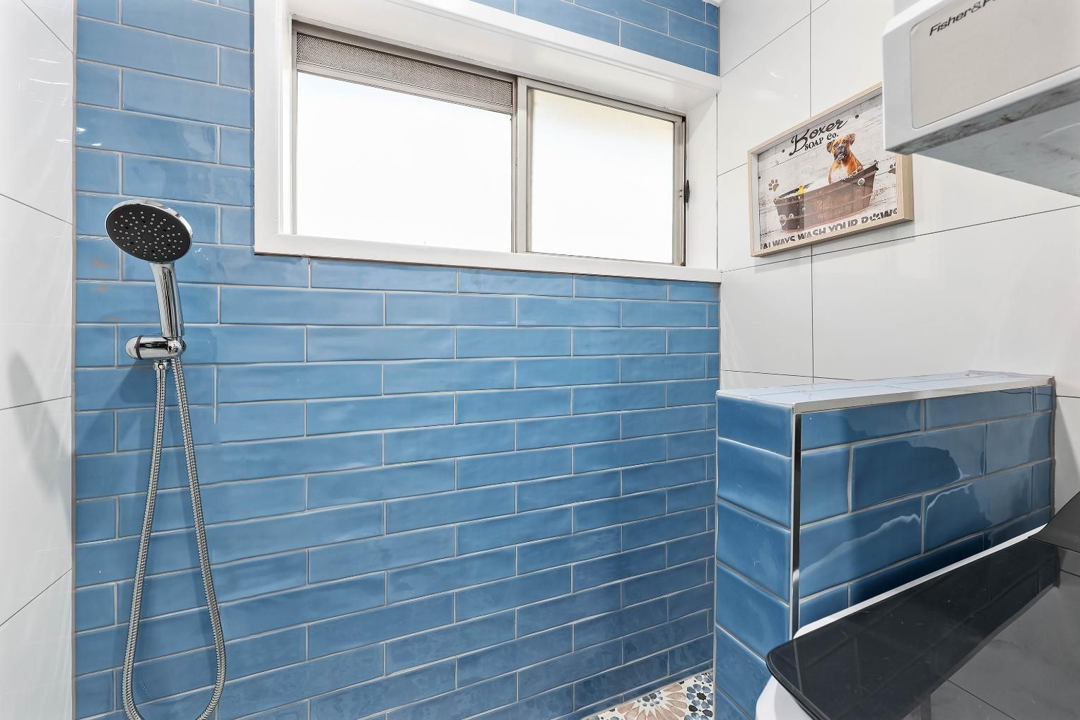 Blue-tiled Shower Room With a Window, Handheld Shower — Above & Beyond Interiors in Smeaton Grange, NSW