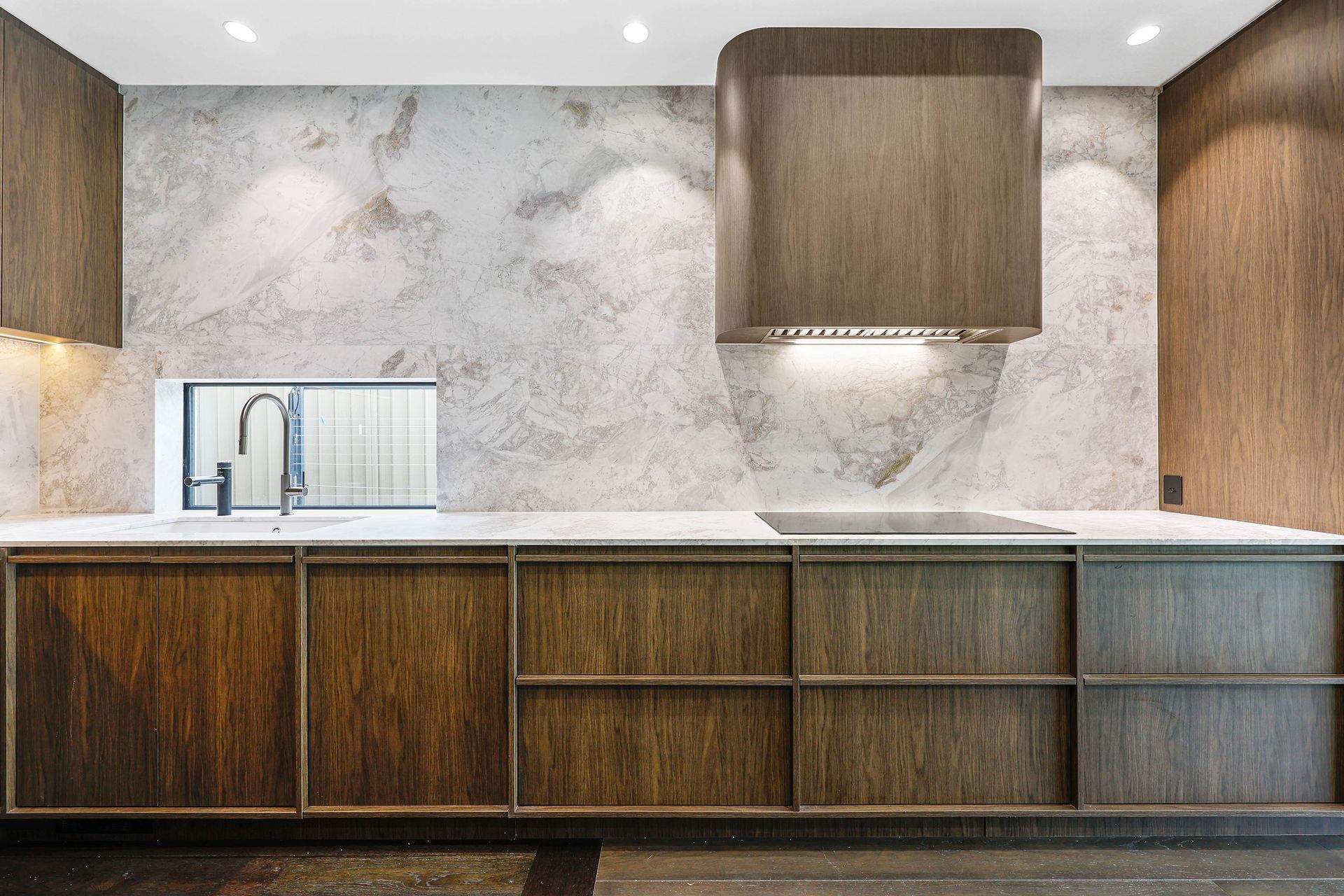 Modern Kitchen With Marble Backsplash — Above & Beyond Interiors in Smeaton Grange, NSW