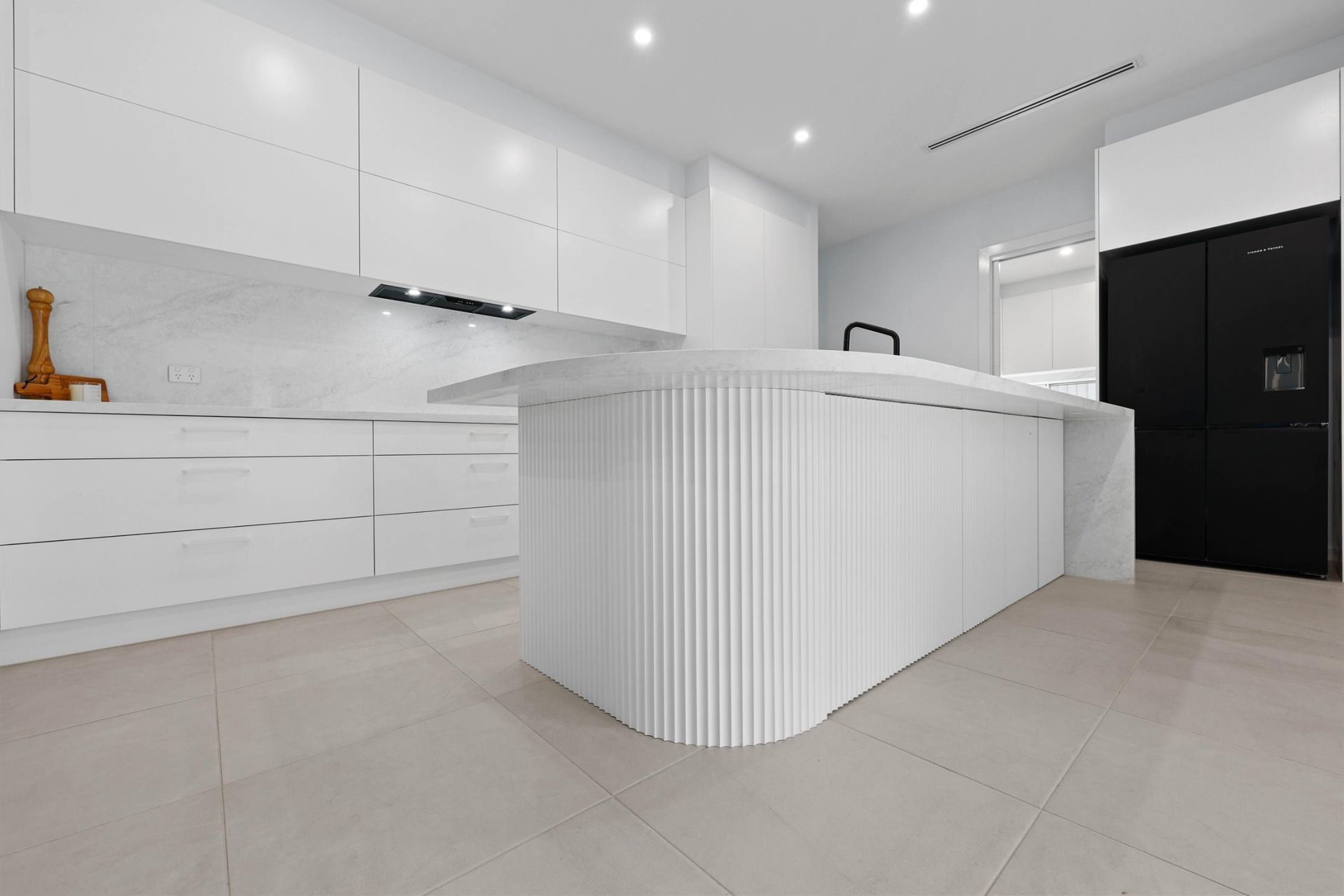 Bright White Modern Kitchen With a Large Island — Above & Beyond Interiors in Smeaton Grange, NSW