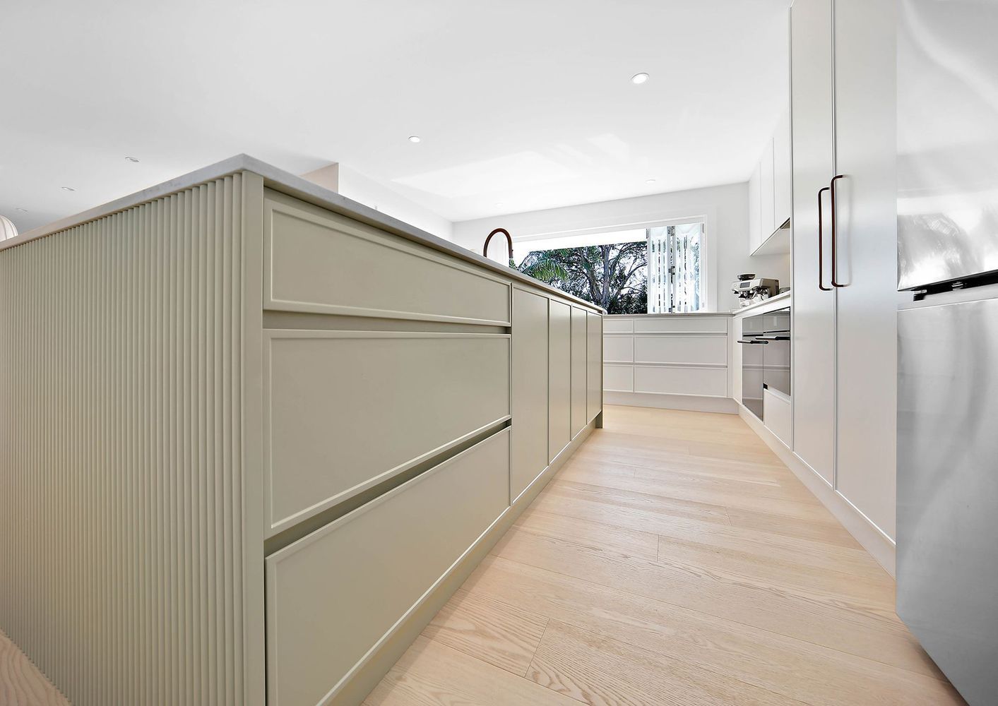 Bright Modern Hallway With White Built-in Cabinets — Above & Beyond Interiors in Smeaton Grange, NSW