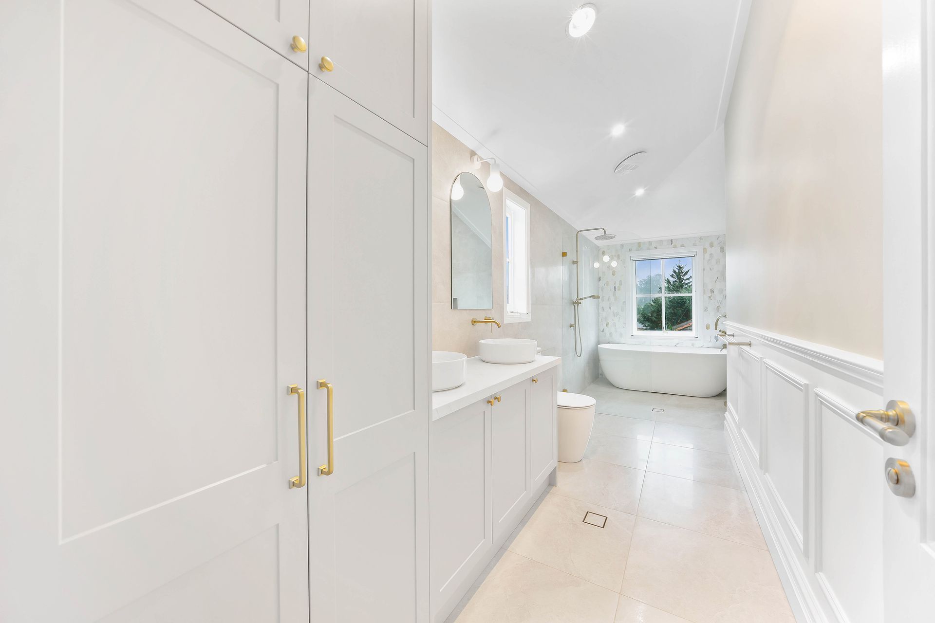 Bright White Hallway With Built-in Cabinets — Above & Beyond Interiors in Smeaton Grange, NSW