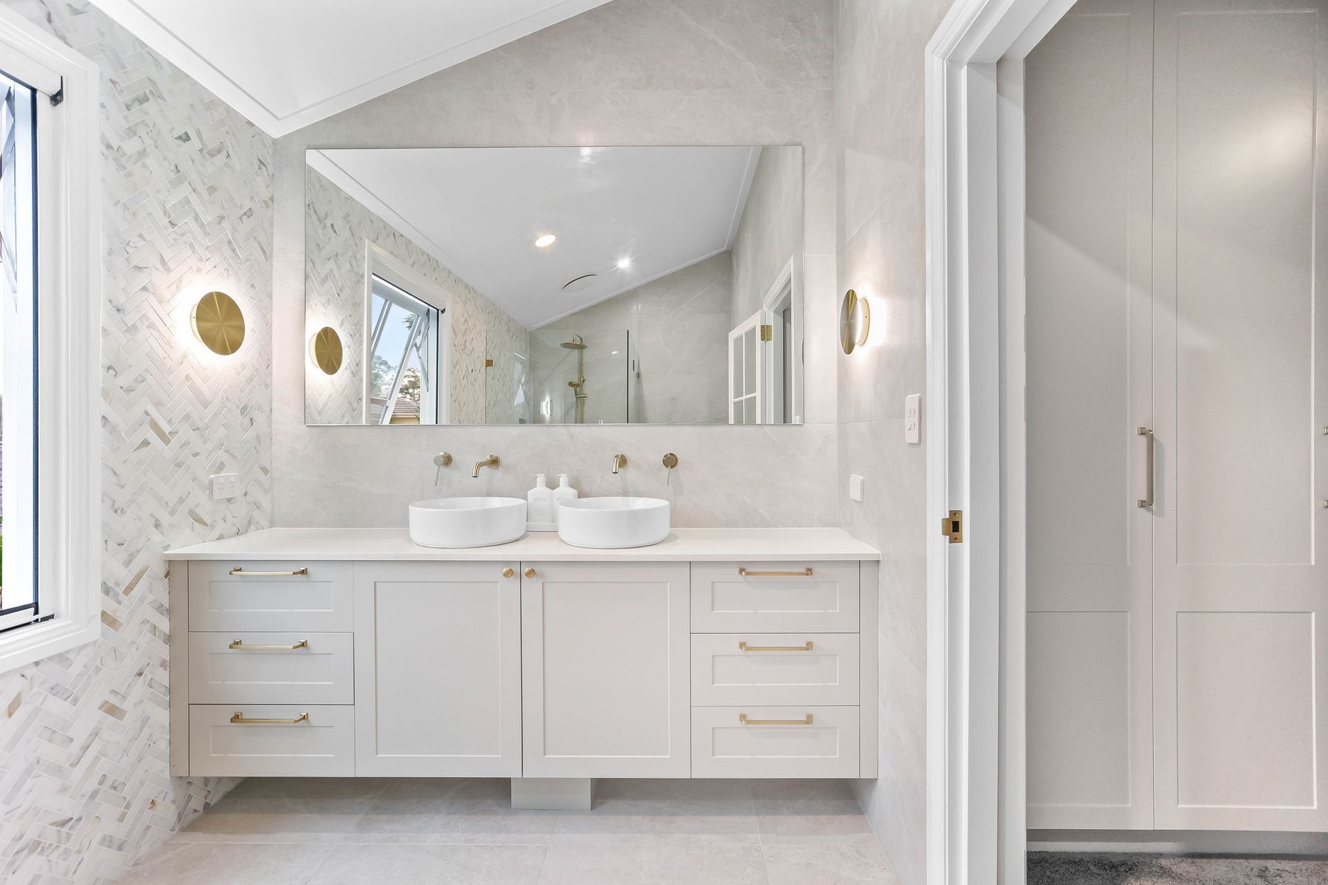 Bright White Bathroom With Double Vanity — Above & Beyond Interiors in Smeaton Grange, NSW