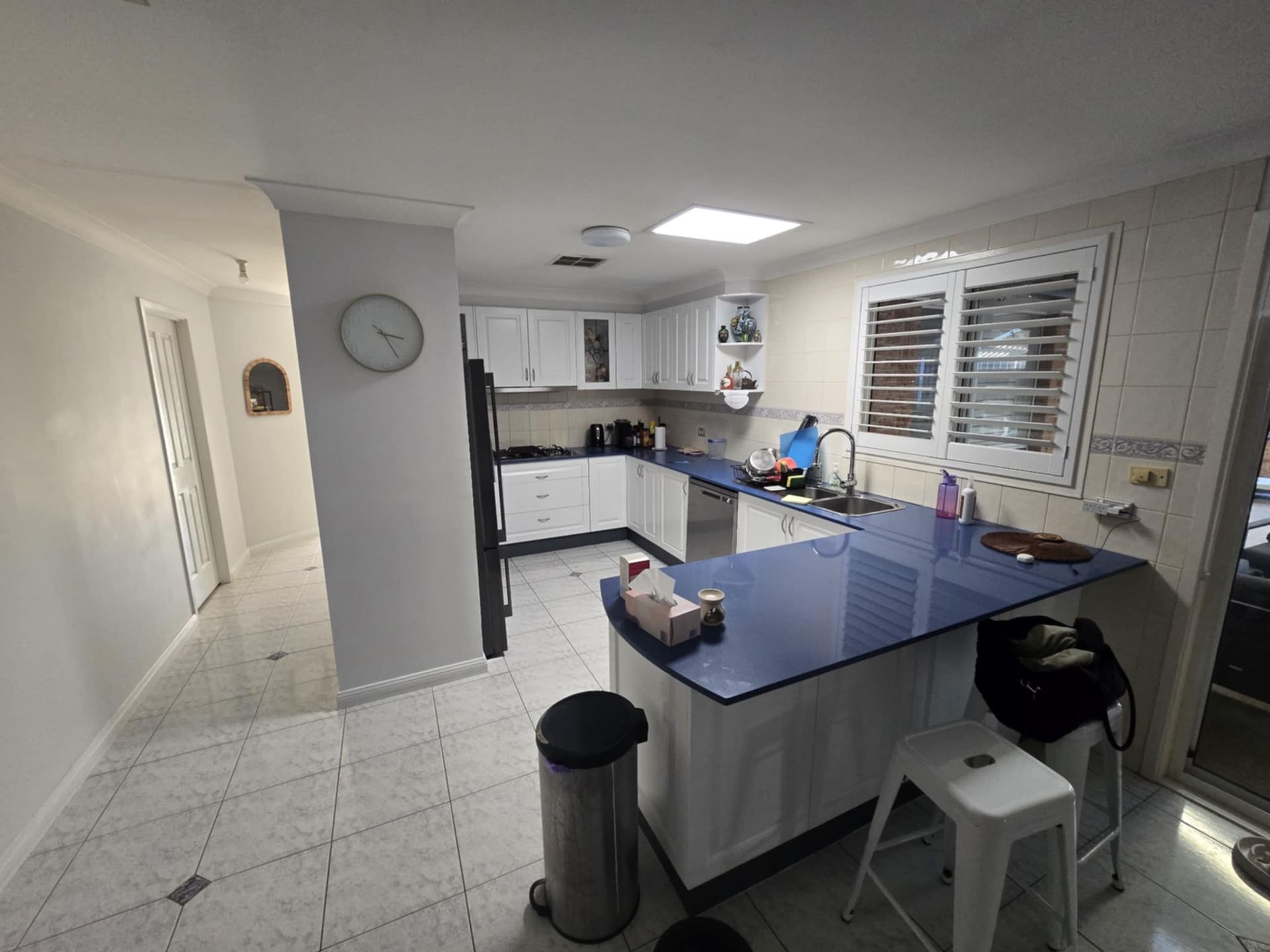 Bright Kitchen with White Cabinets — Above & Beyond Interiors in Smeaton Grange, NSW