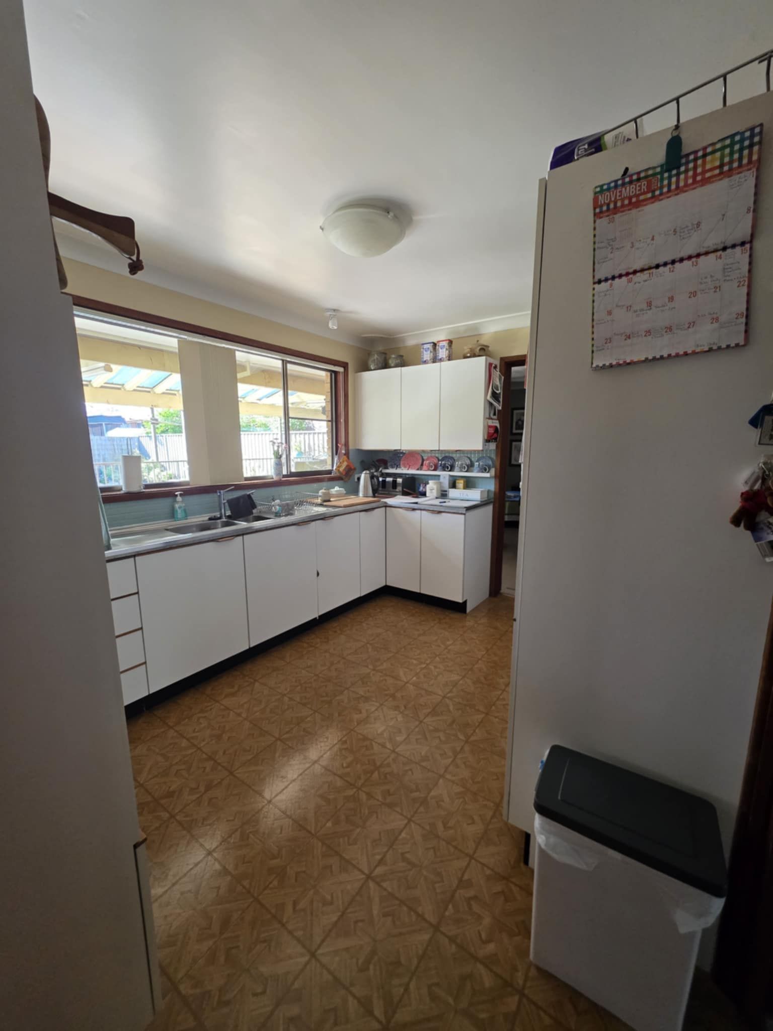 A Bright Kitchen with Tiled Floor — Above & Beyond Interiors in Smeaton Grange, NSW