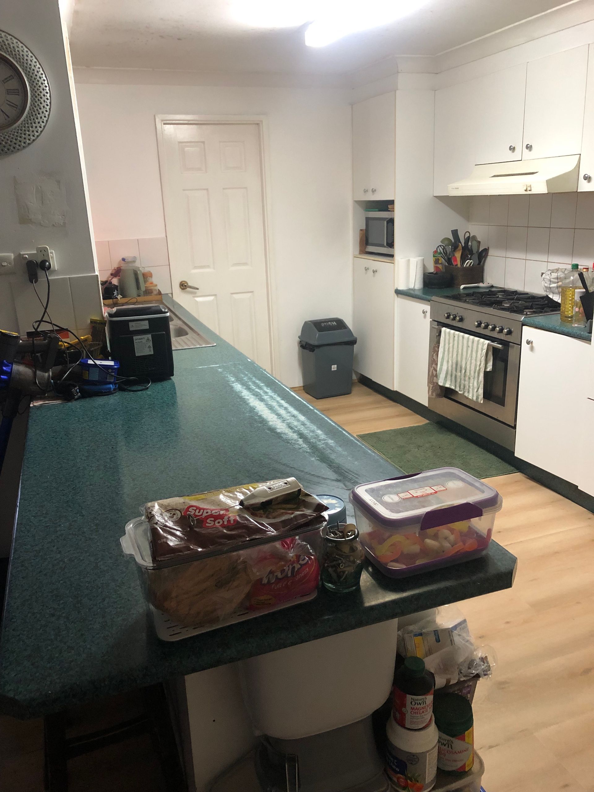 Small Kitchen with Teal Counter — Above & Beyond Interiors in Smeaton Grange, NSW