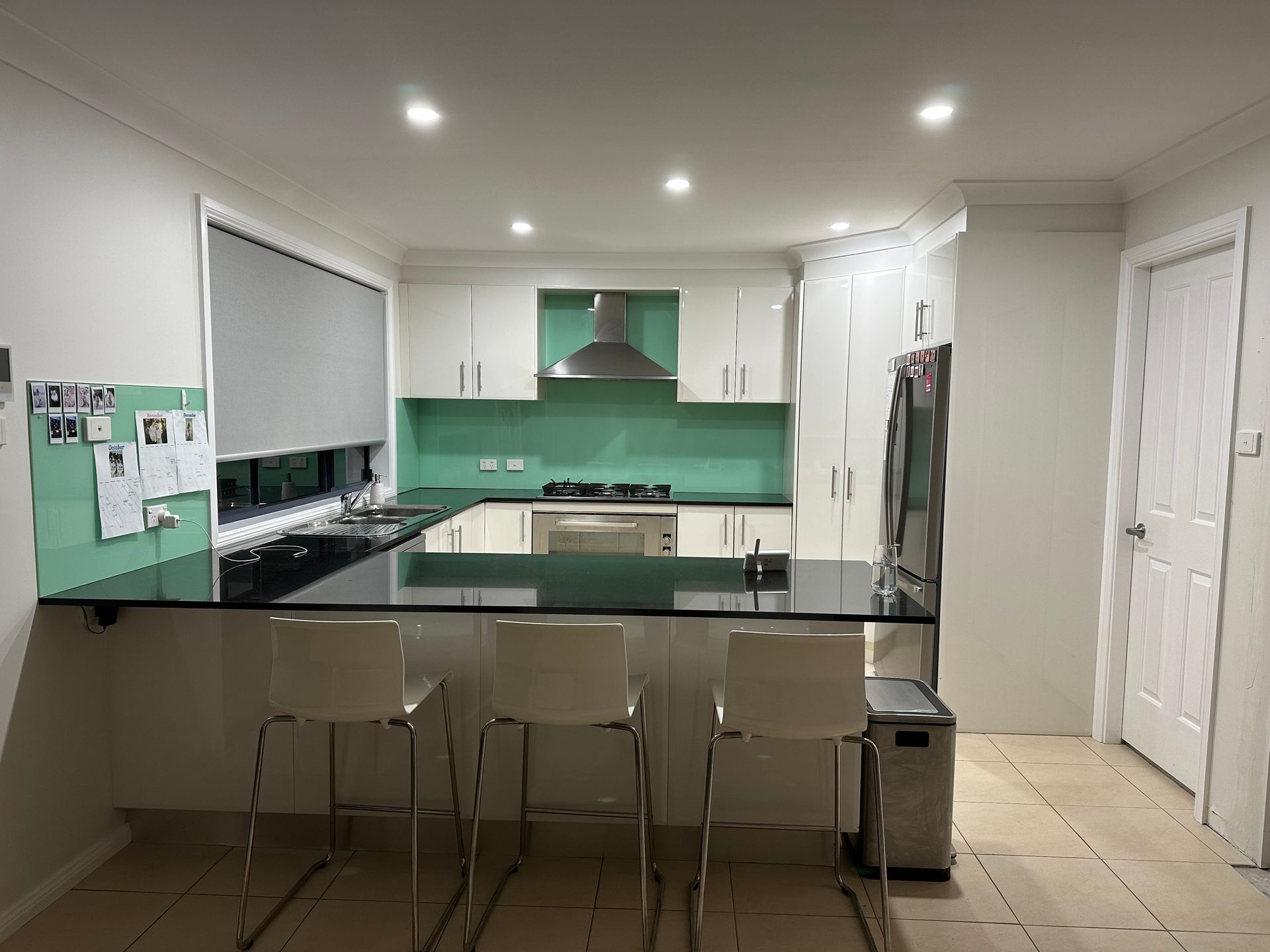 Modern Kitchen with White Cabinets — Above & Beyond Interiors in Smeaton Grange, NSW
