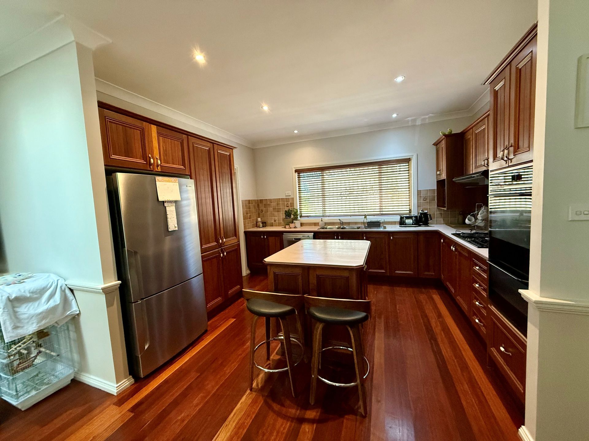 A Kitchen with Cabinets — Above & Beyond Interiors in Smeaton Grange, NSW