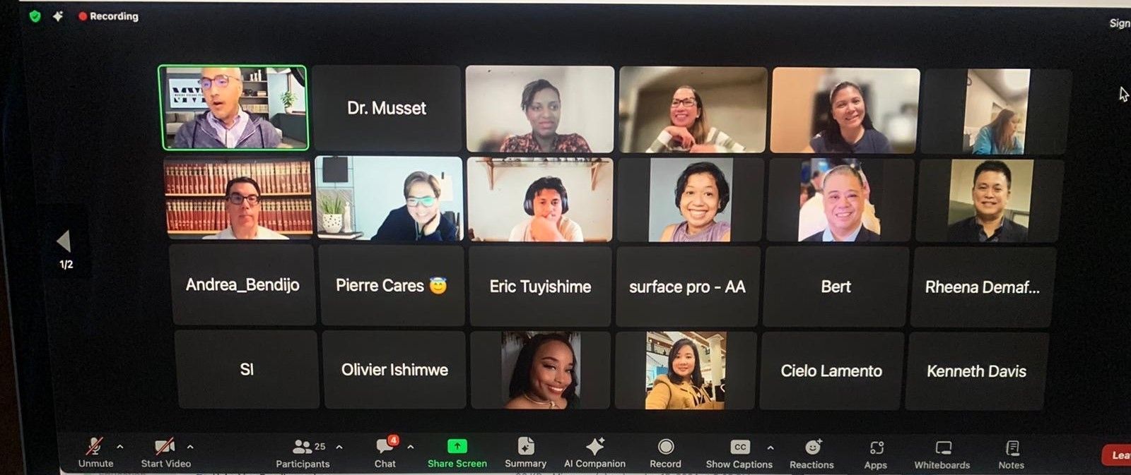 A group of people are having a video call on a laptop.